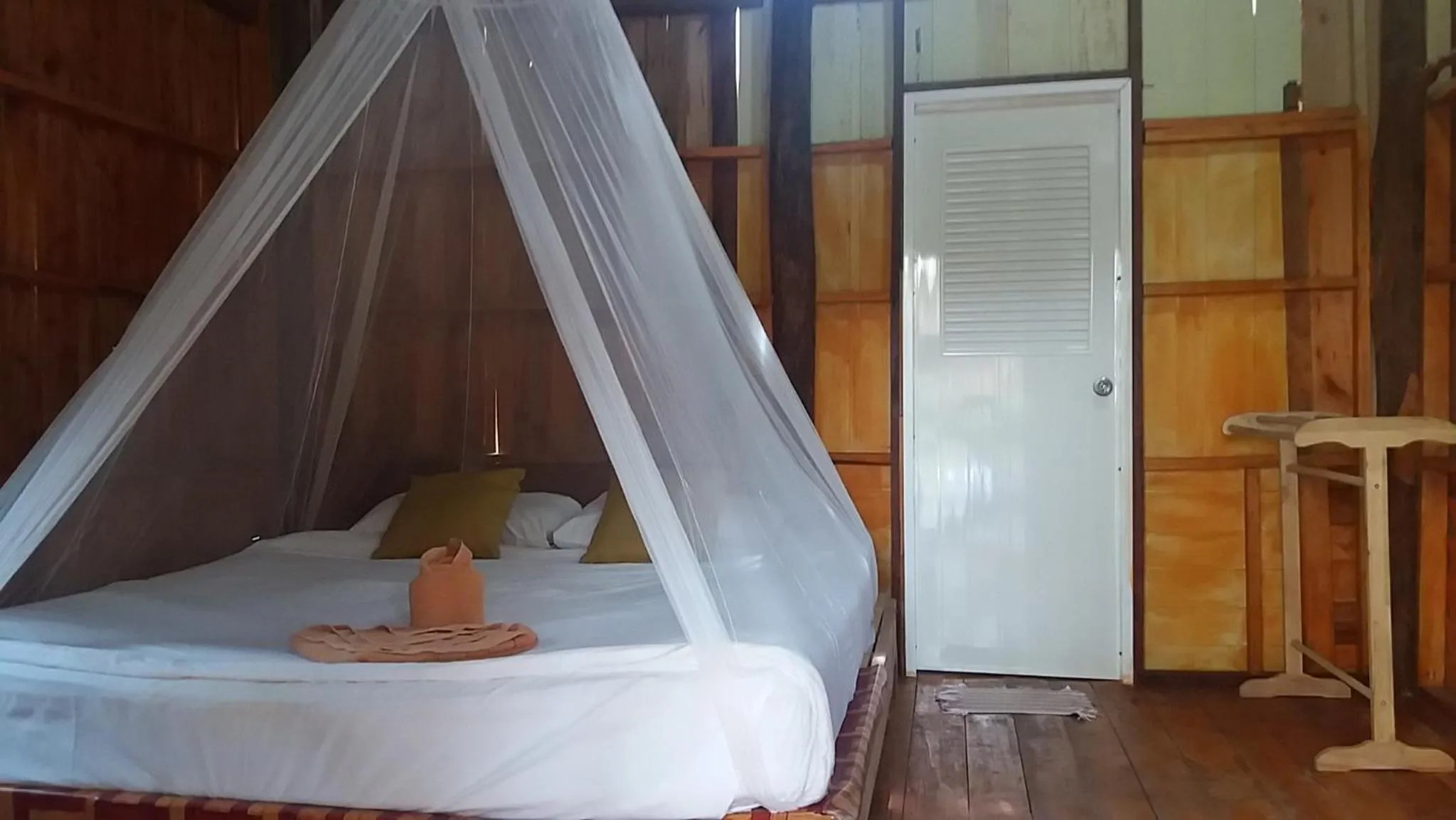 Bed in Jungle Hill Beach Bungalow