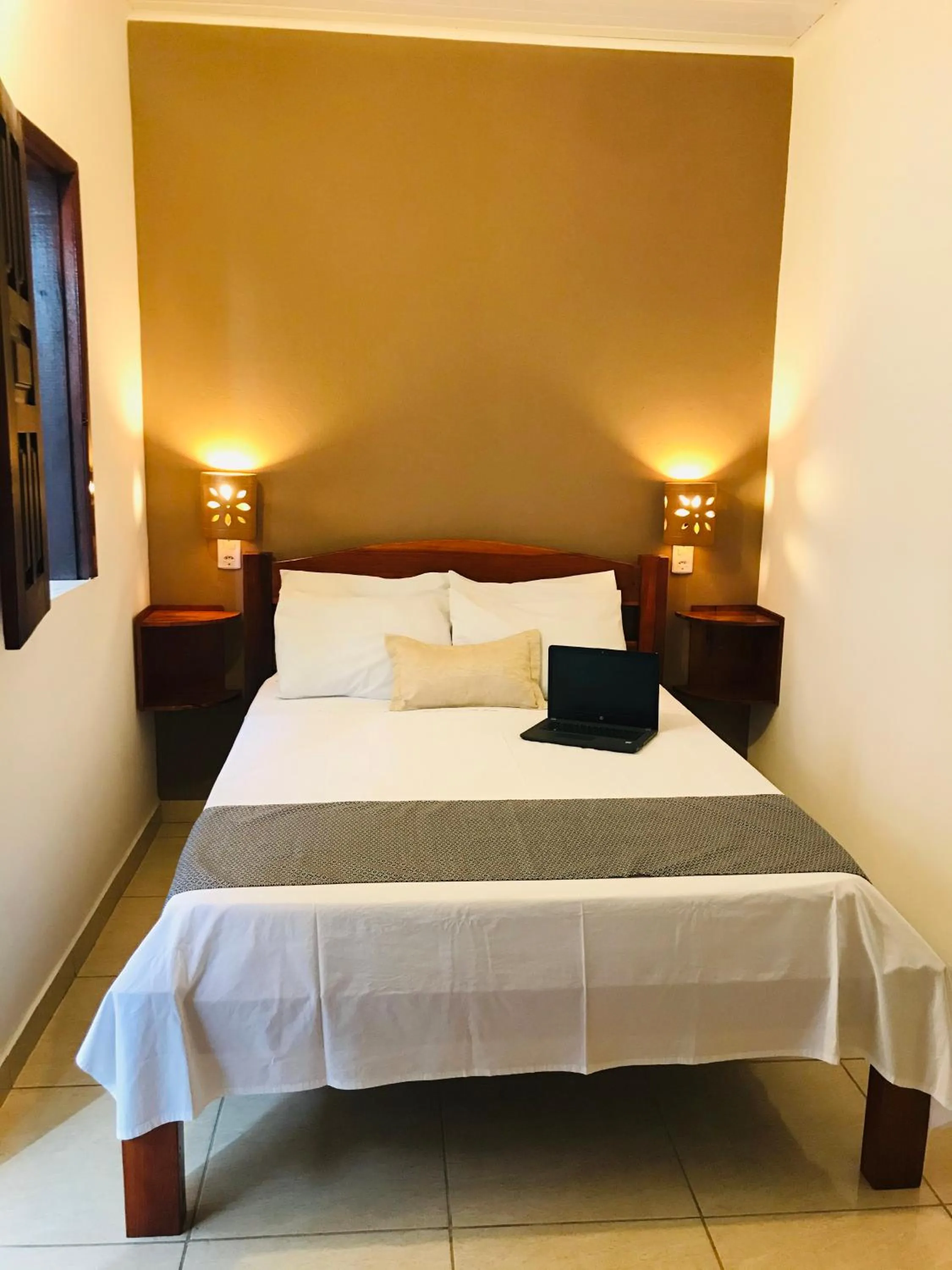 Bed in Pousada Ilha do Encanto