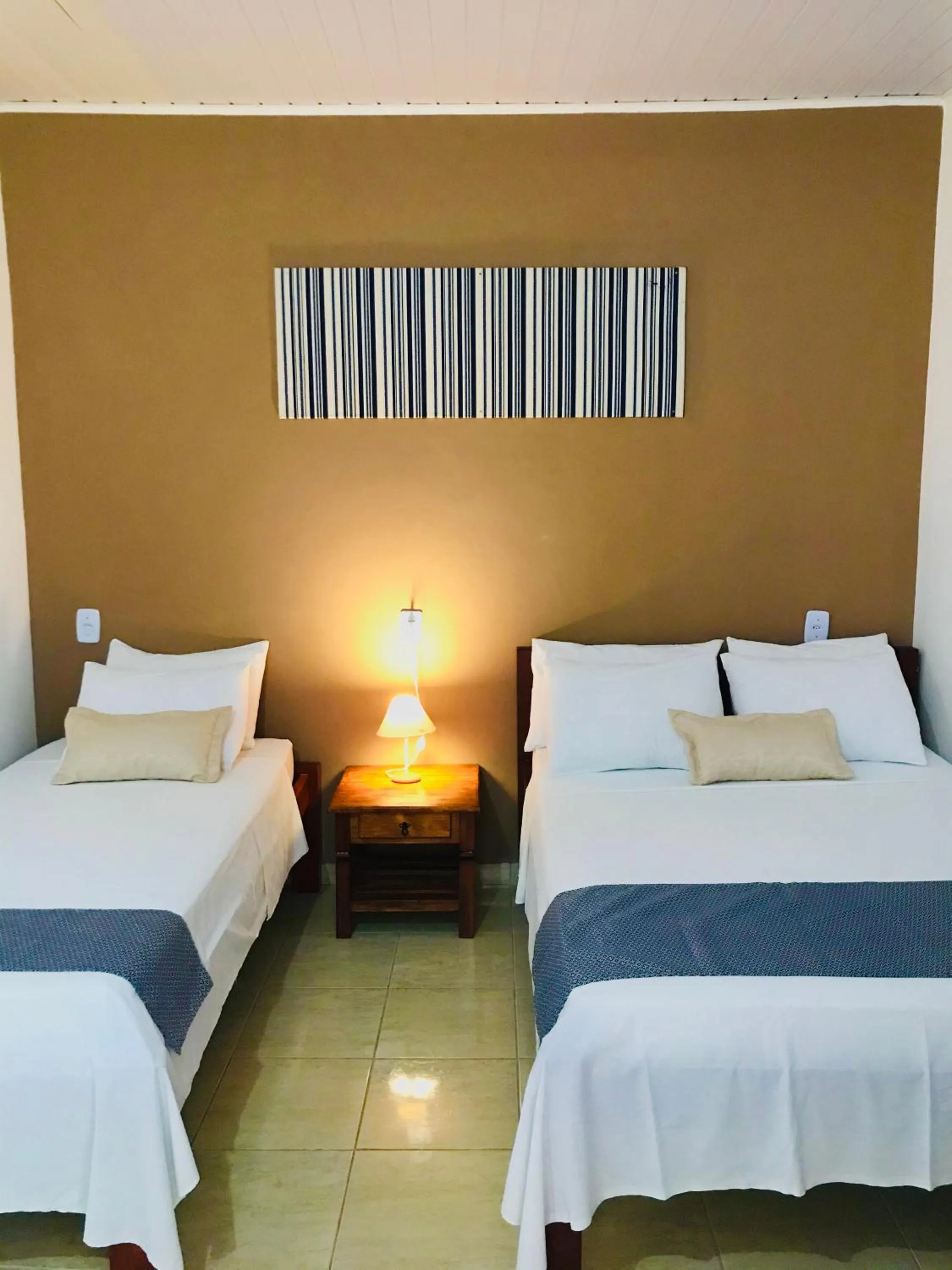 Bed in Pousada Ilha do Encanto