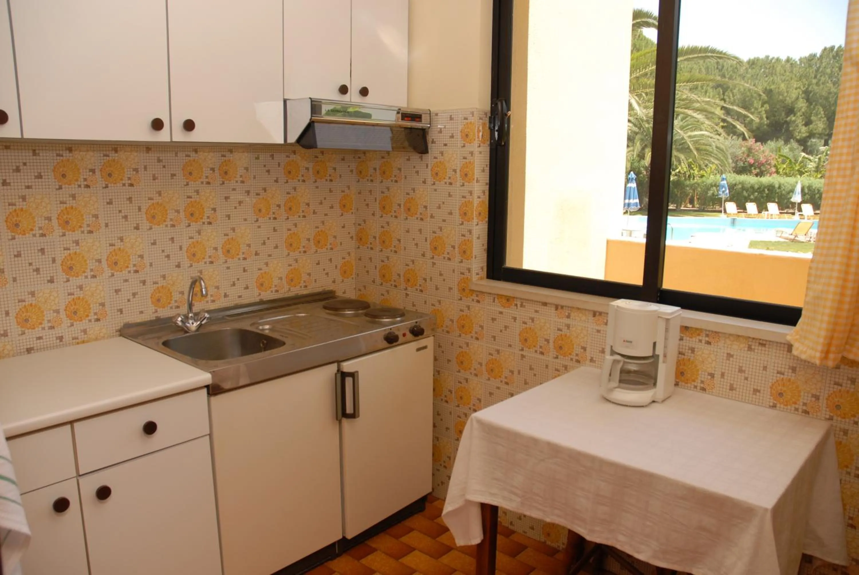 Kitchen or kitchenette in Niki Hotel Apartments
