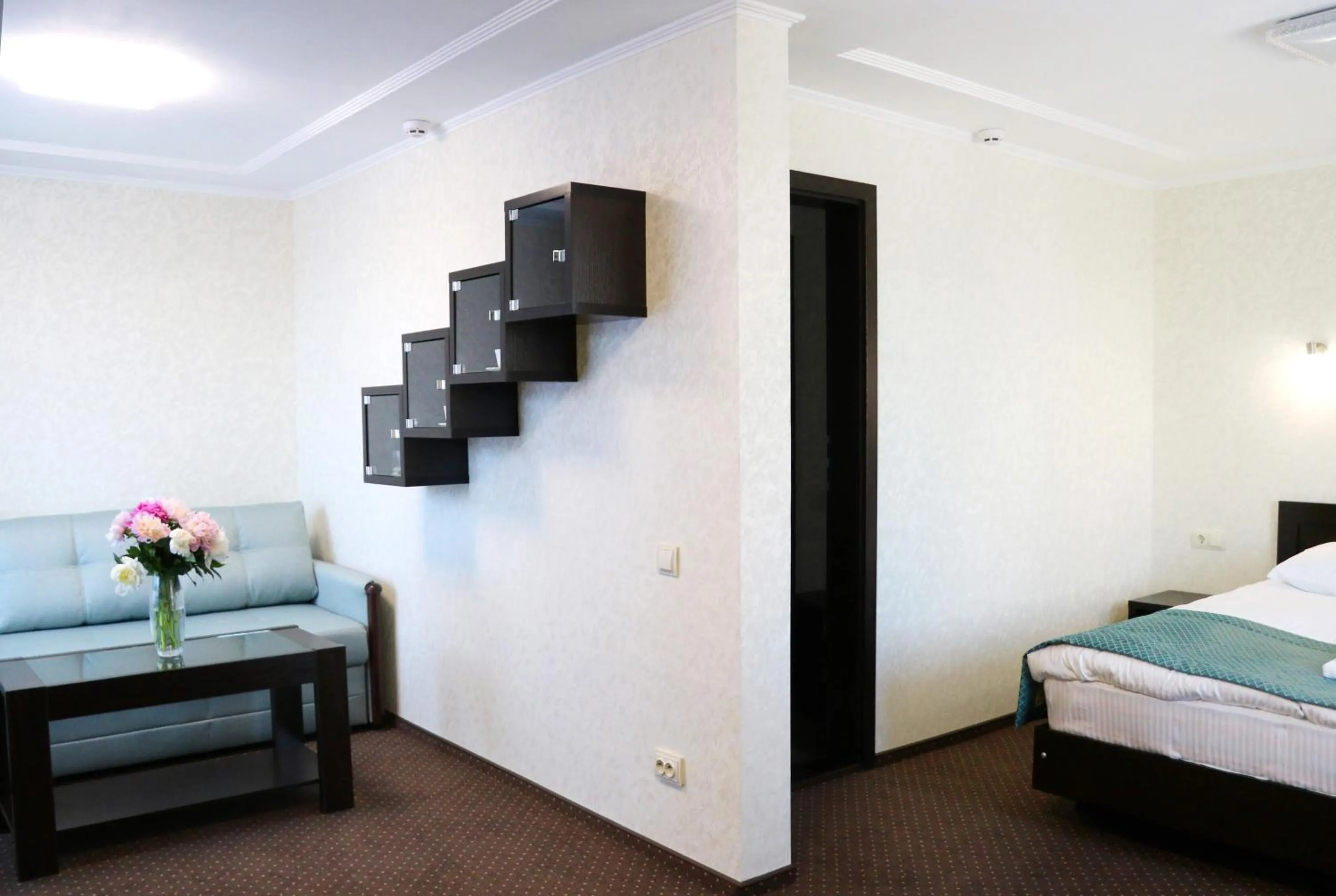 Seating area, Bed in Hotel Tourist