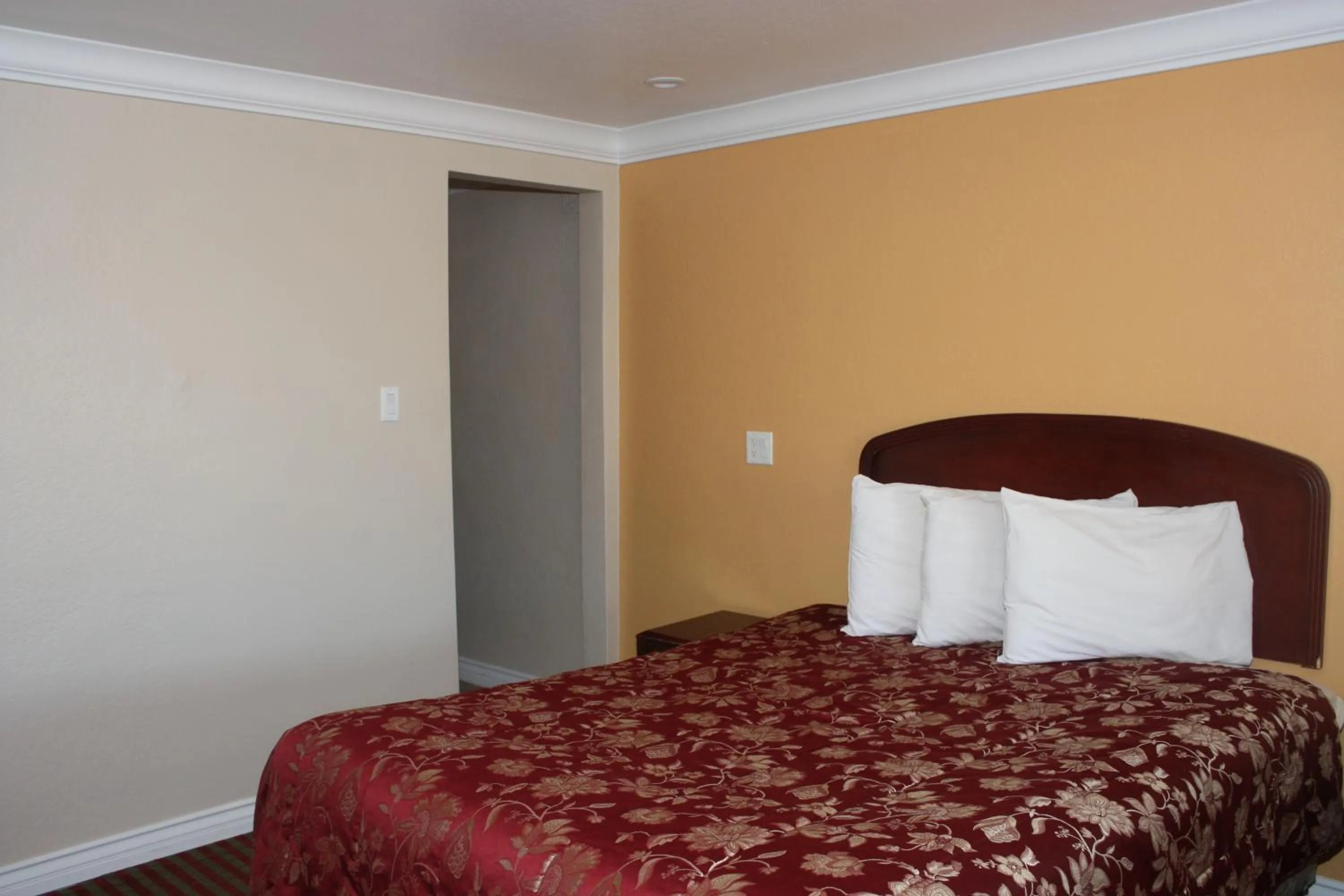 Bed in A-1 Budget Motel