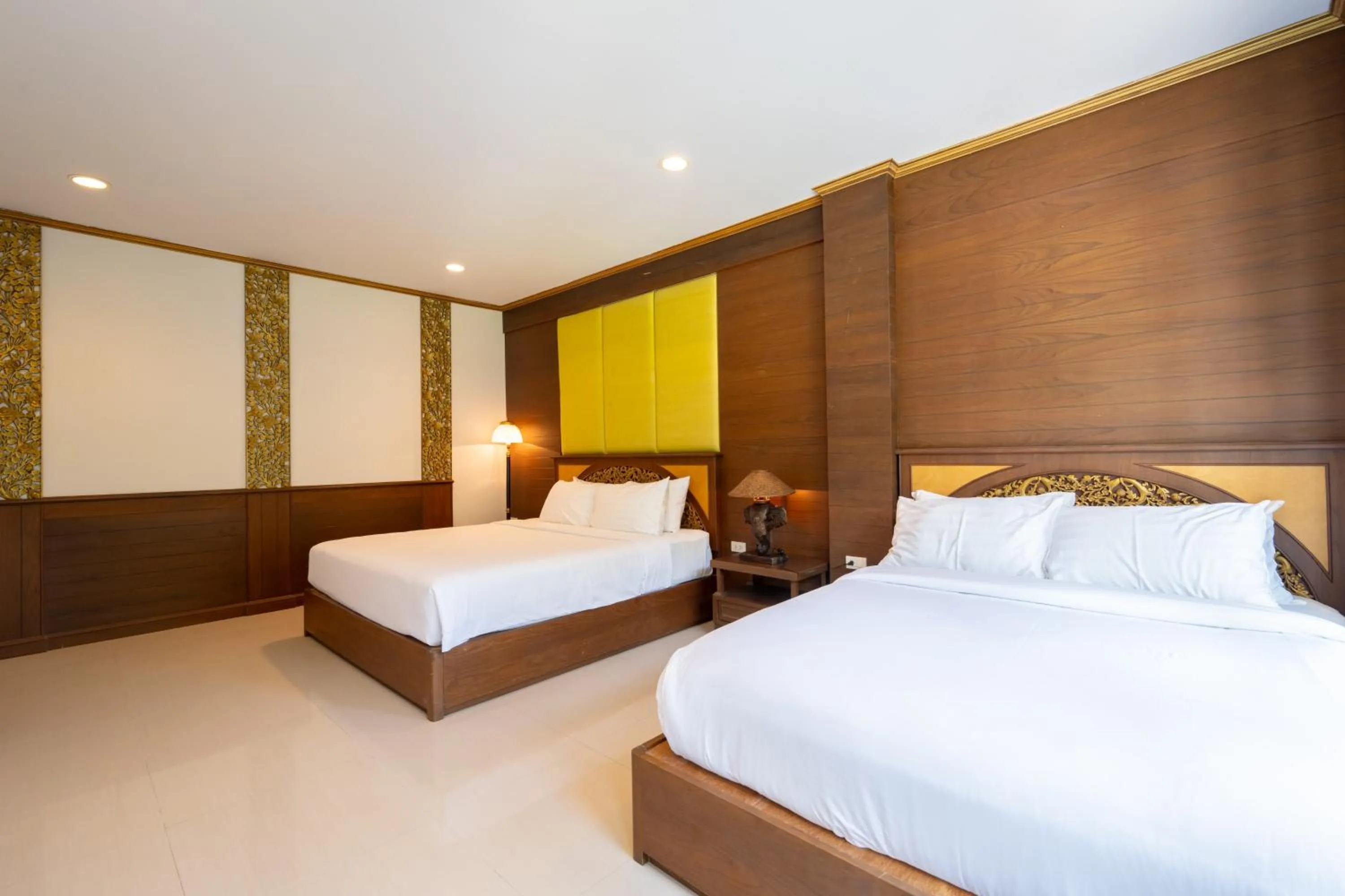 Bed in The Green Beach Resort