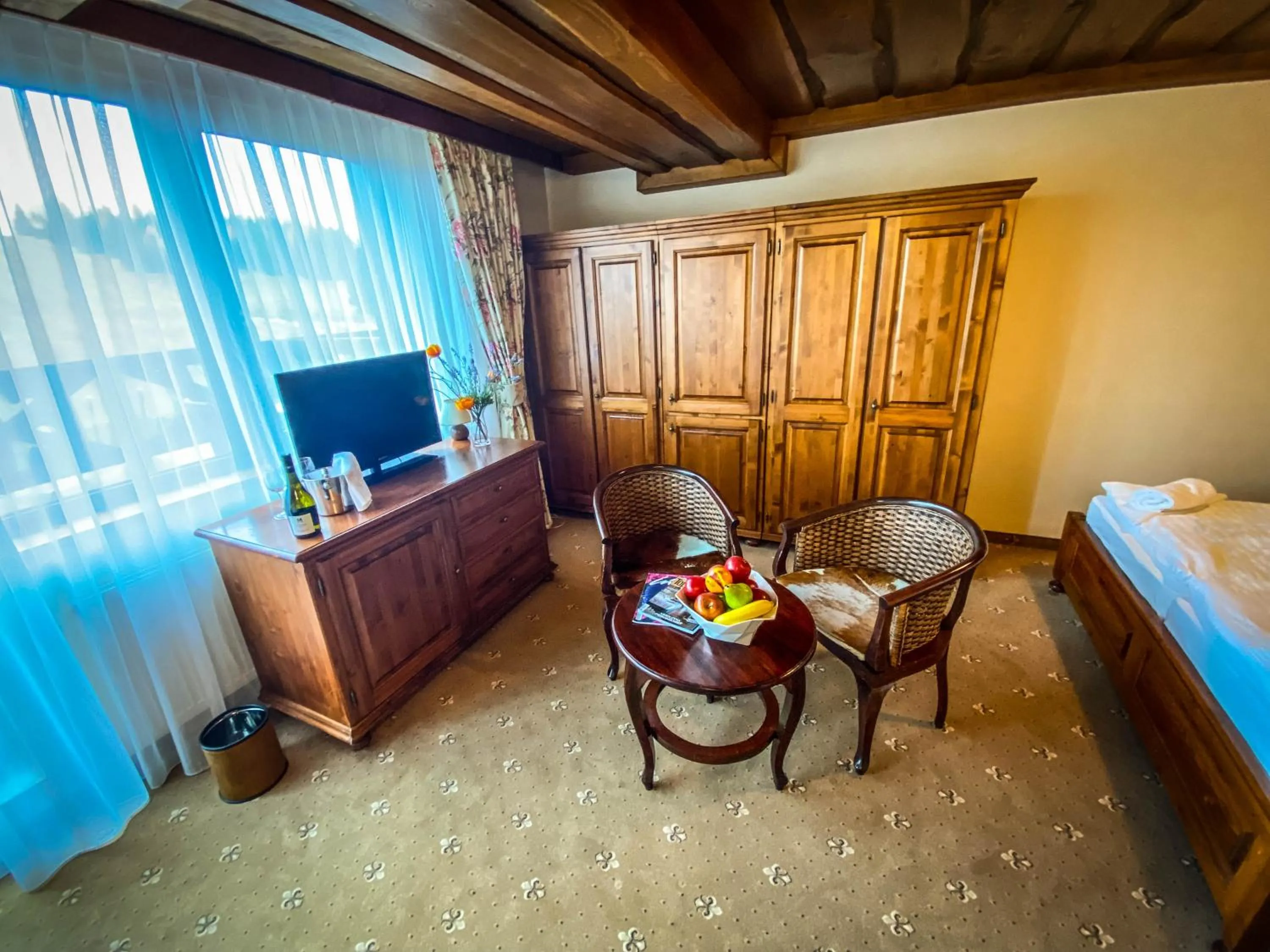 Seating area, Bed in Wellness Hotel Encian Donovaly