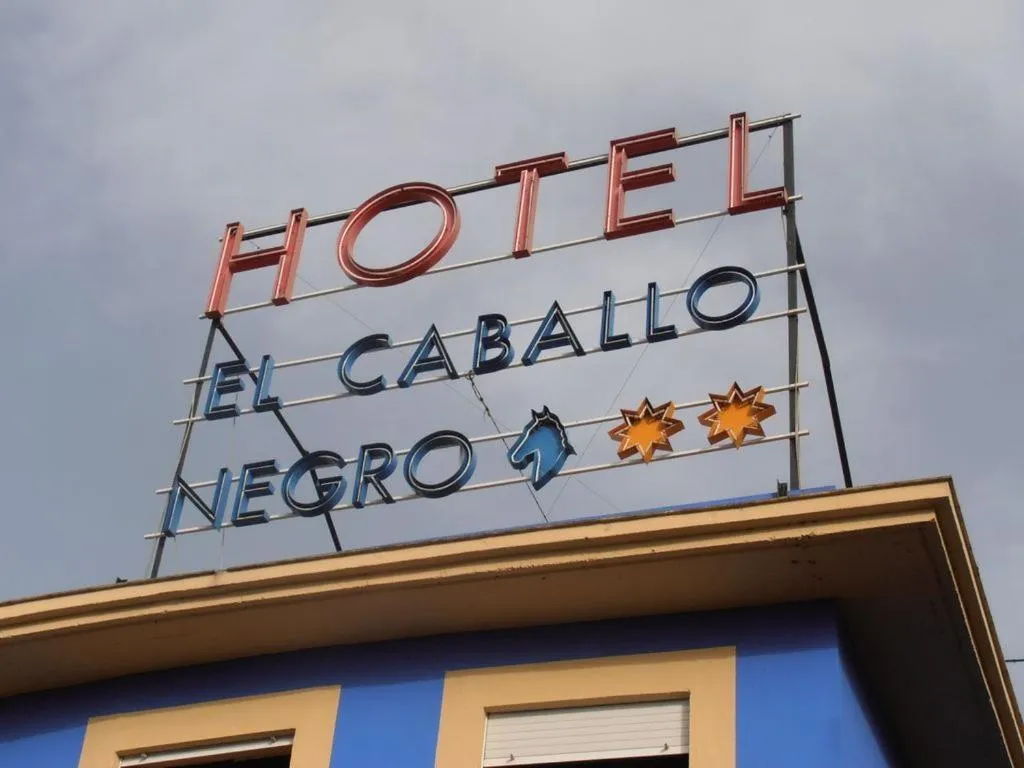 Property logo or sign in Hotel Caballo Negro