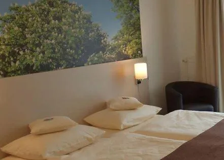 Seating area, Bed in Das Neue Hotel Am Park