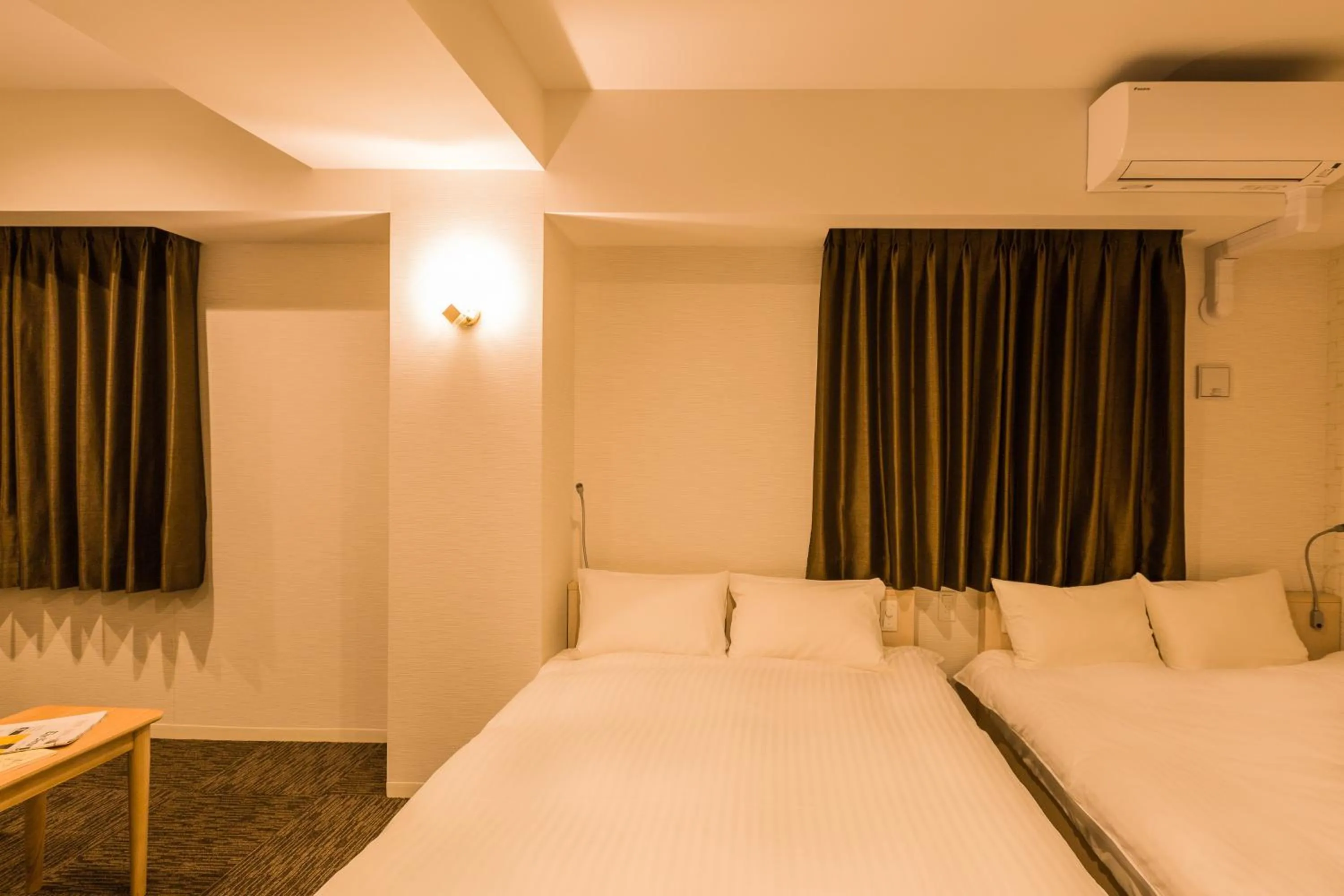 Photo of the whole room, Bed in EIWA PLACE HOTEL Hakata