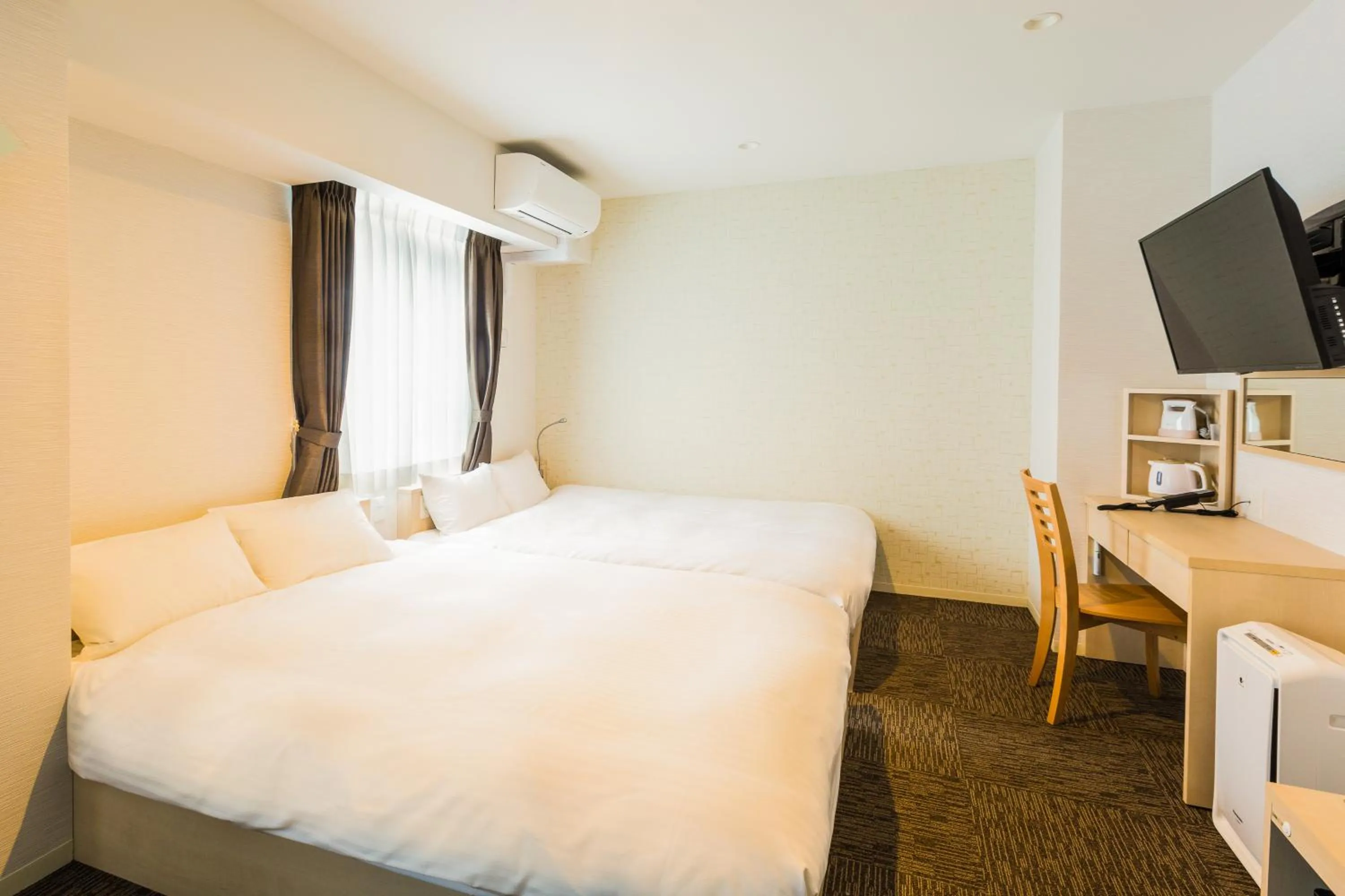 Photo of the whole room, Bed in EIWA PLACE HOTEL Hakata