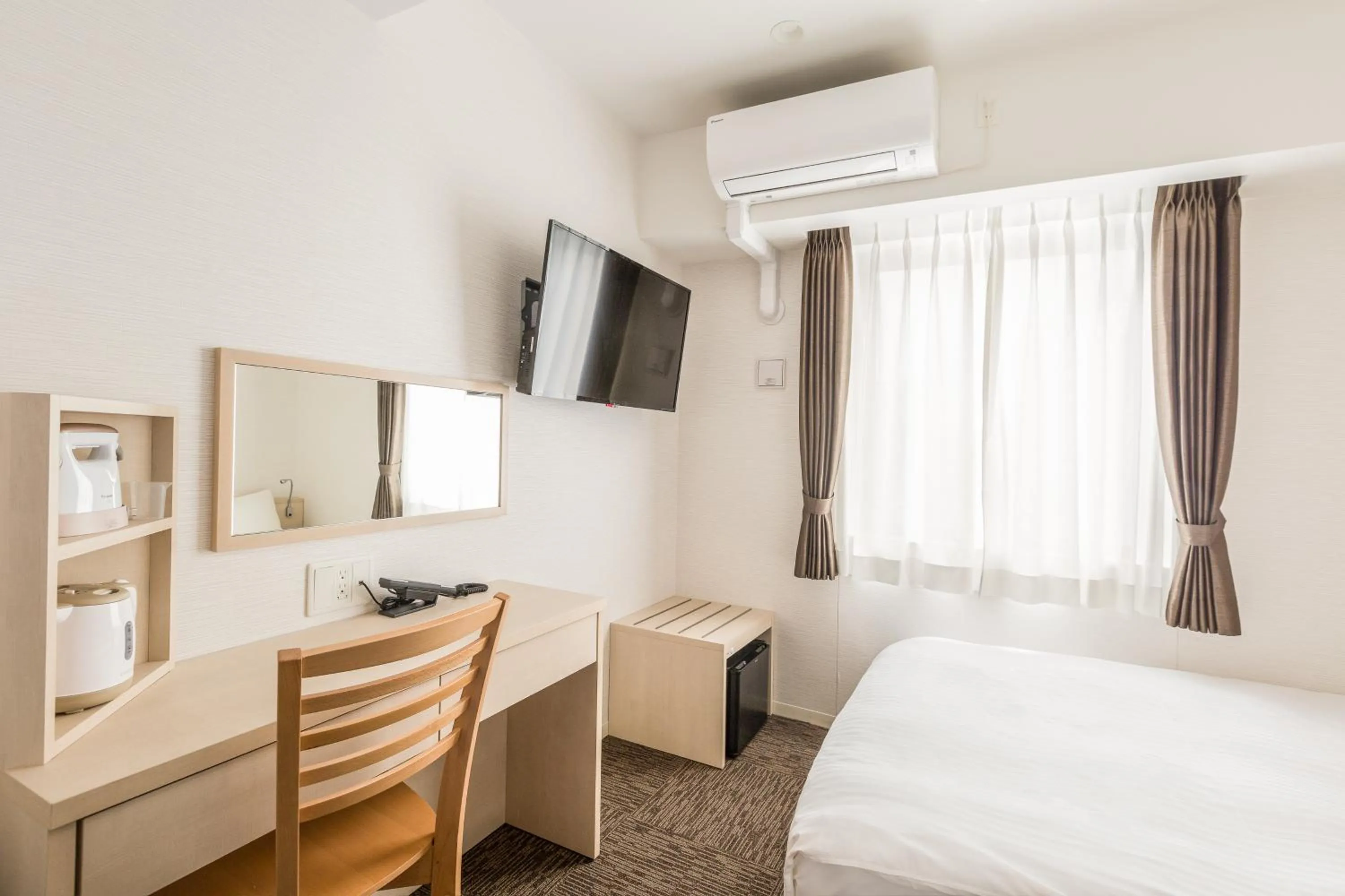 Photo of the whole room, Bed in EIWA PLACE HOTEL Hakata