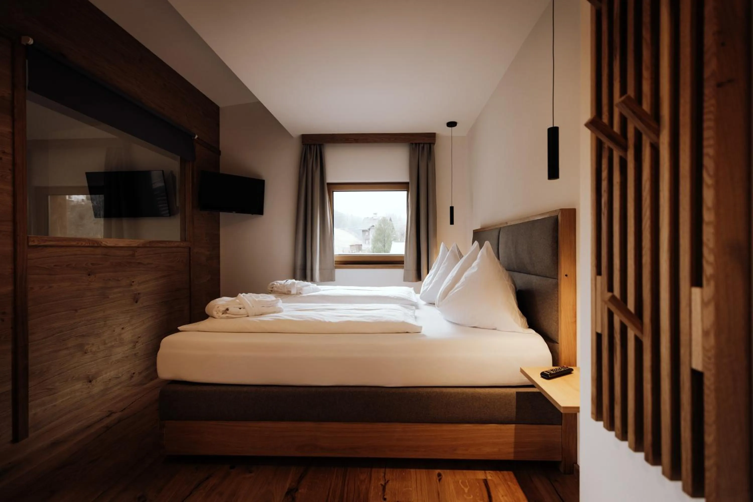 Photo of the whole room, Bed in FORSTAUERWiRT Hotel & Restaurant