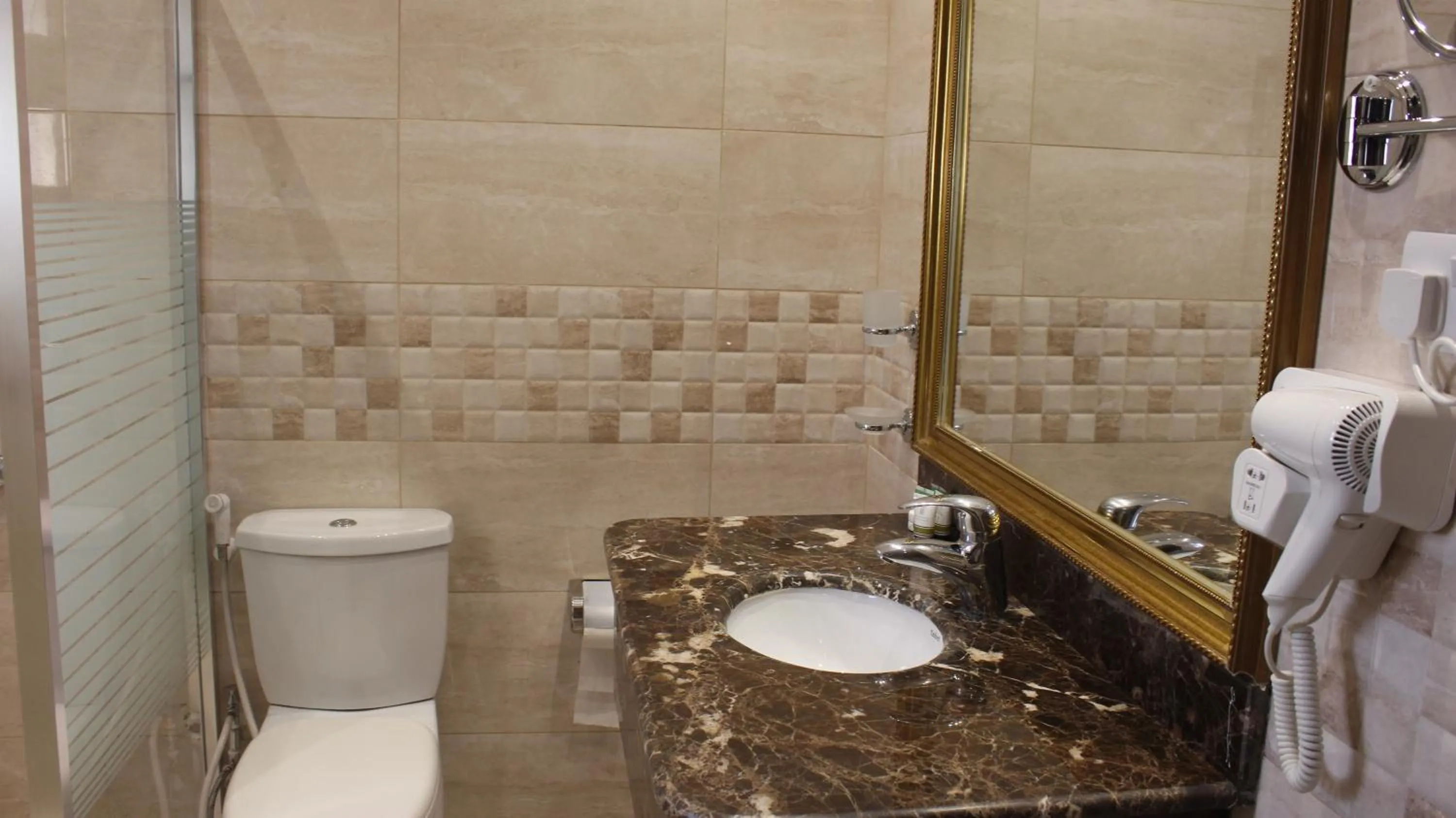 Toilet in Terrace Furnished Apartments- Salmiya