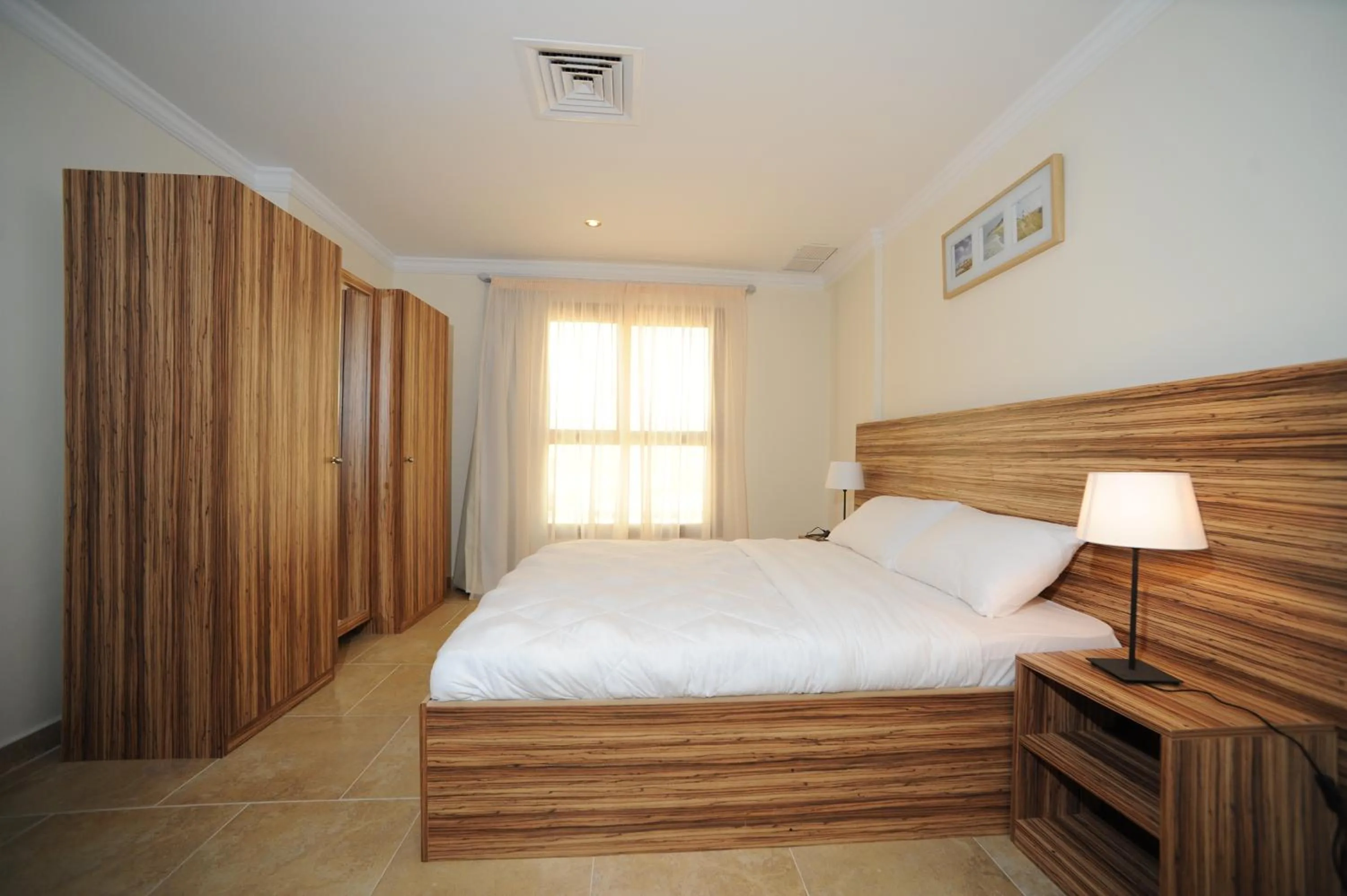 Bedroom, Bed in Terrace Furnished Apartments- Salmiya