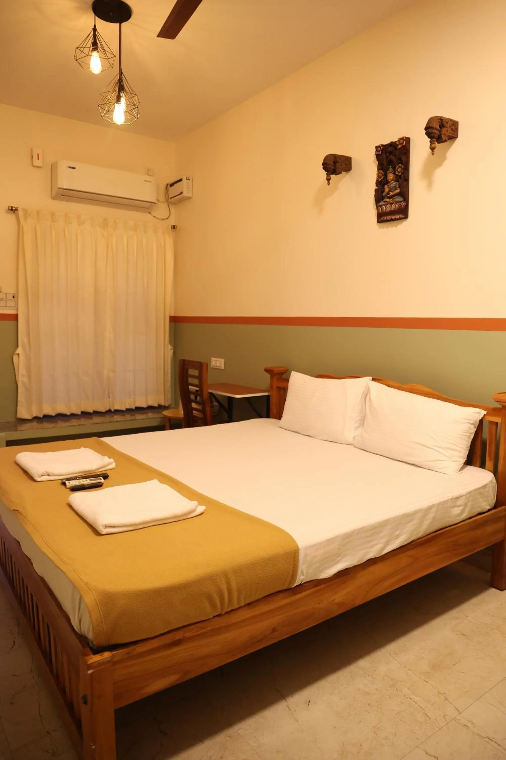 Photo of the whole room, Bed in Dwaraka Guest House