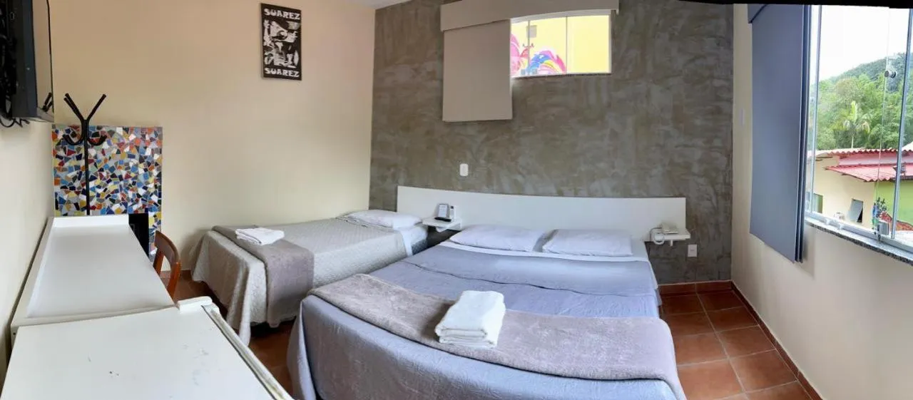 Bed in Pousada Suarez