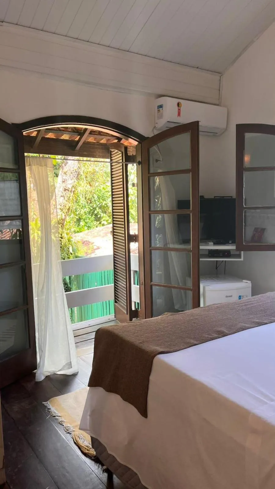 Bed in Pousada Canto do Camburi