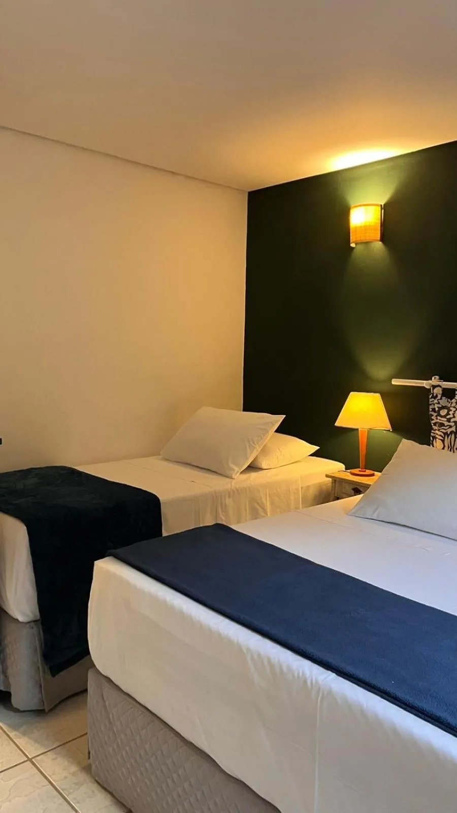 Bed in Pousada Canto do Camburi