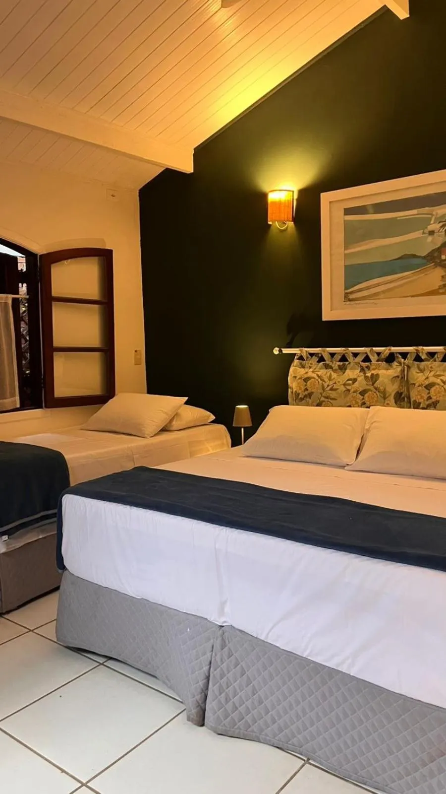 Bed in Pousada Canto do Camburi