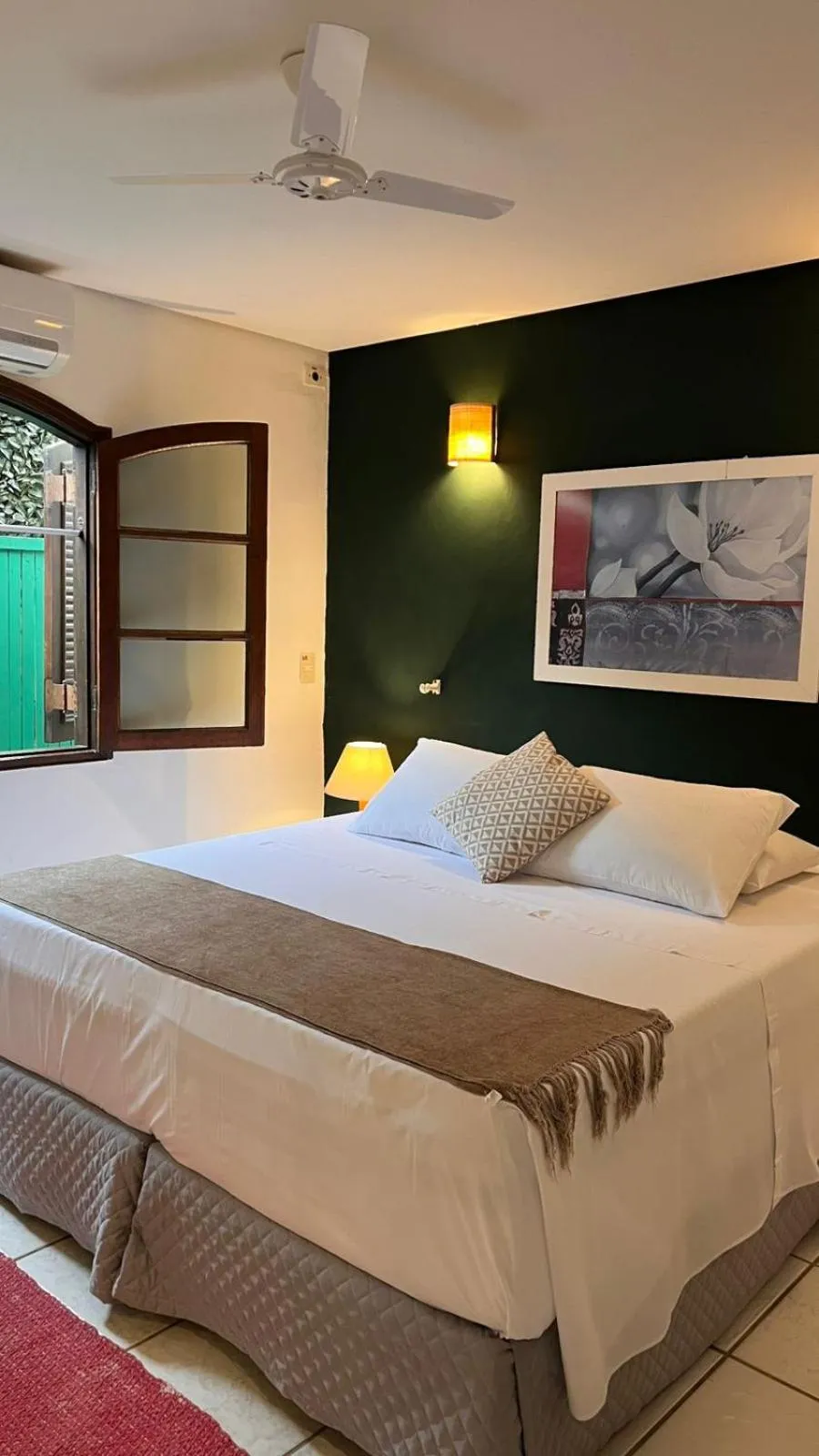 Bed in Pousada Canto do Camburi