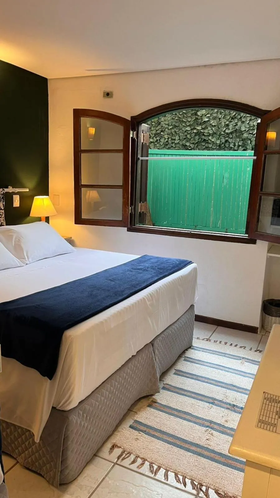 Bed in Pousada Canto do Camburi