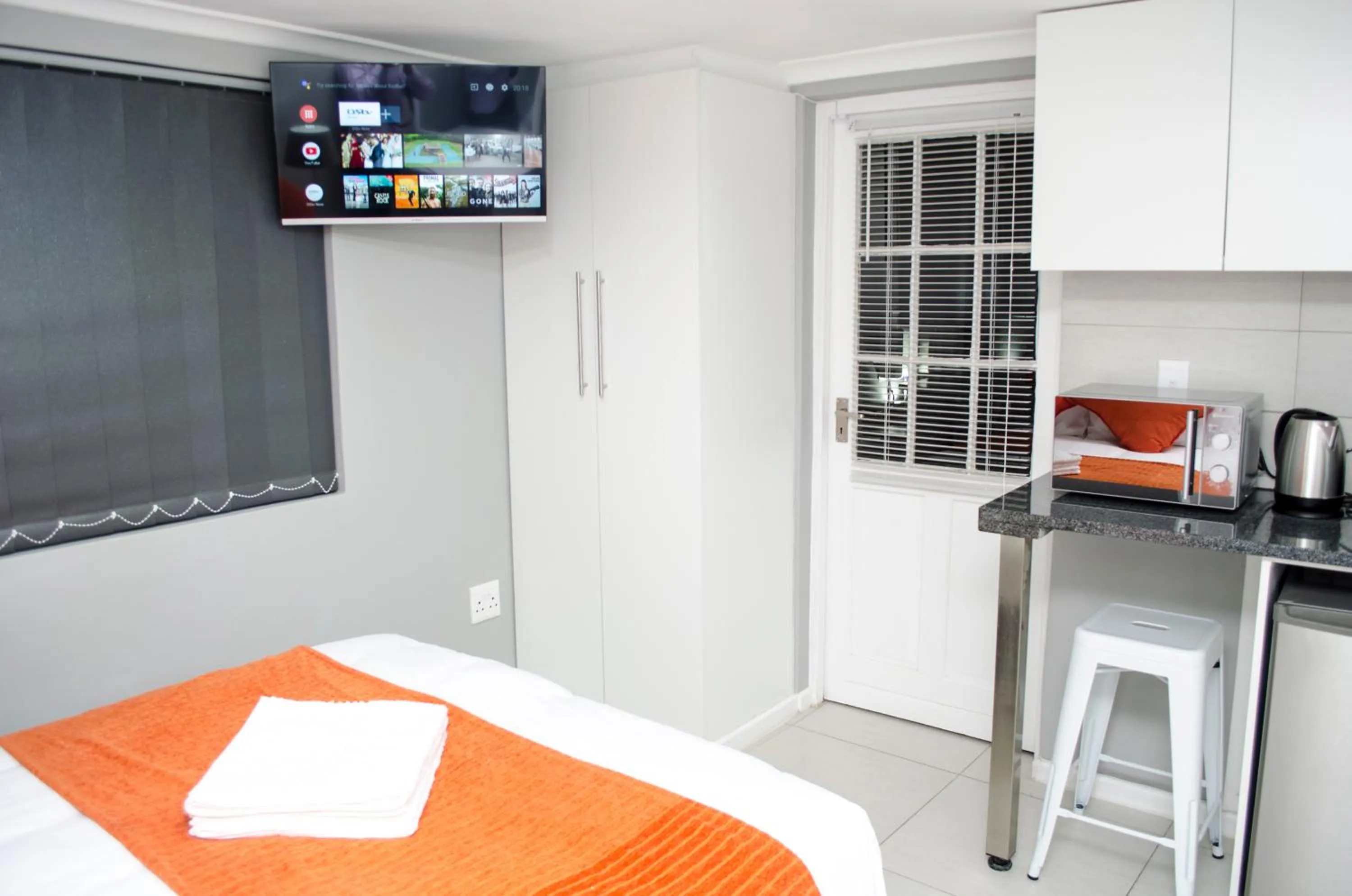 TV and multimedia, Bed in Cape Town Micro Apartments