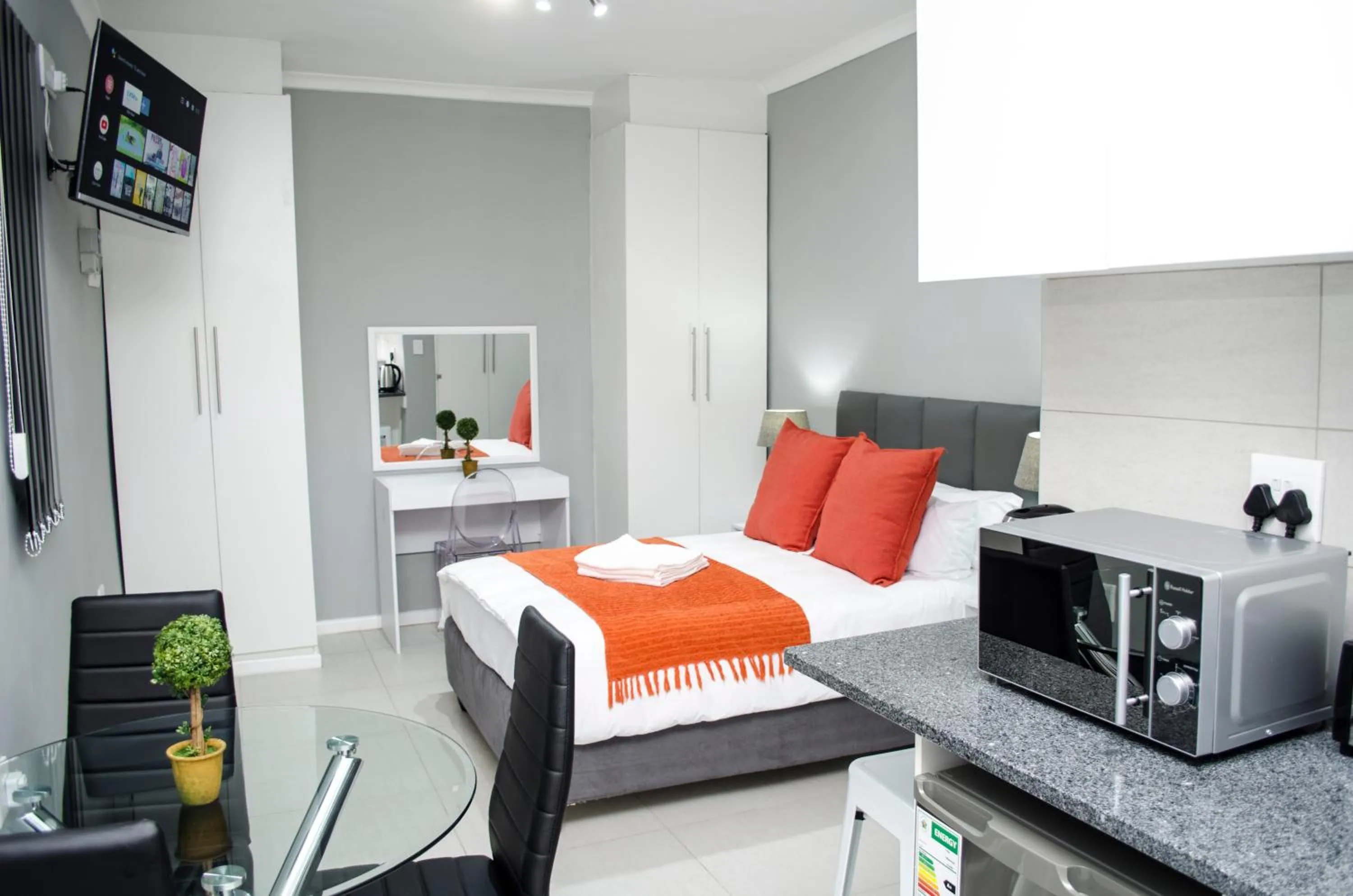 TV and multimedia, Bed in Cape Town Micro Apartments