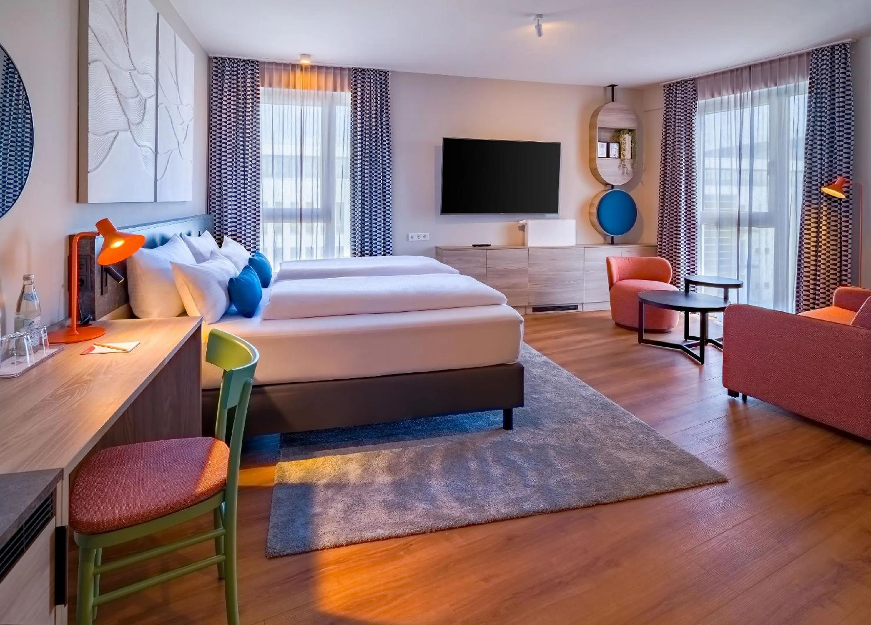 Communal lounge/ TV room, Bed in Ramada Encore by Wyndham Munich Messe