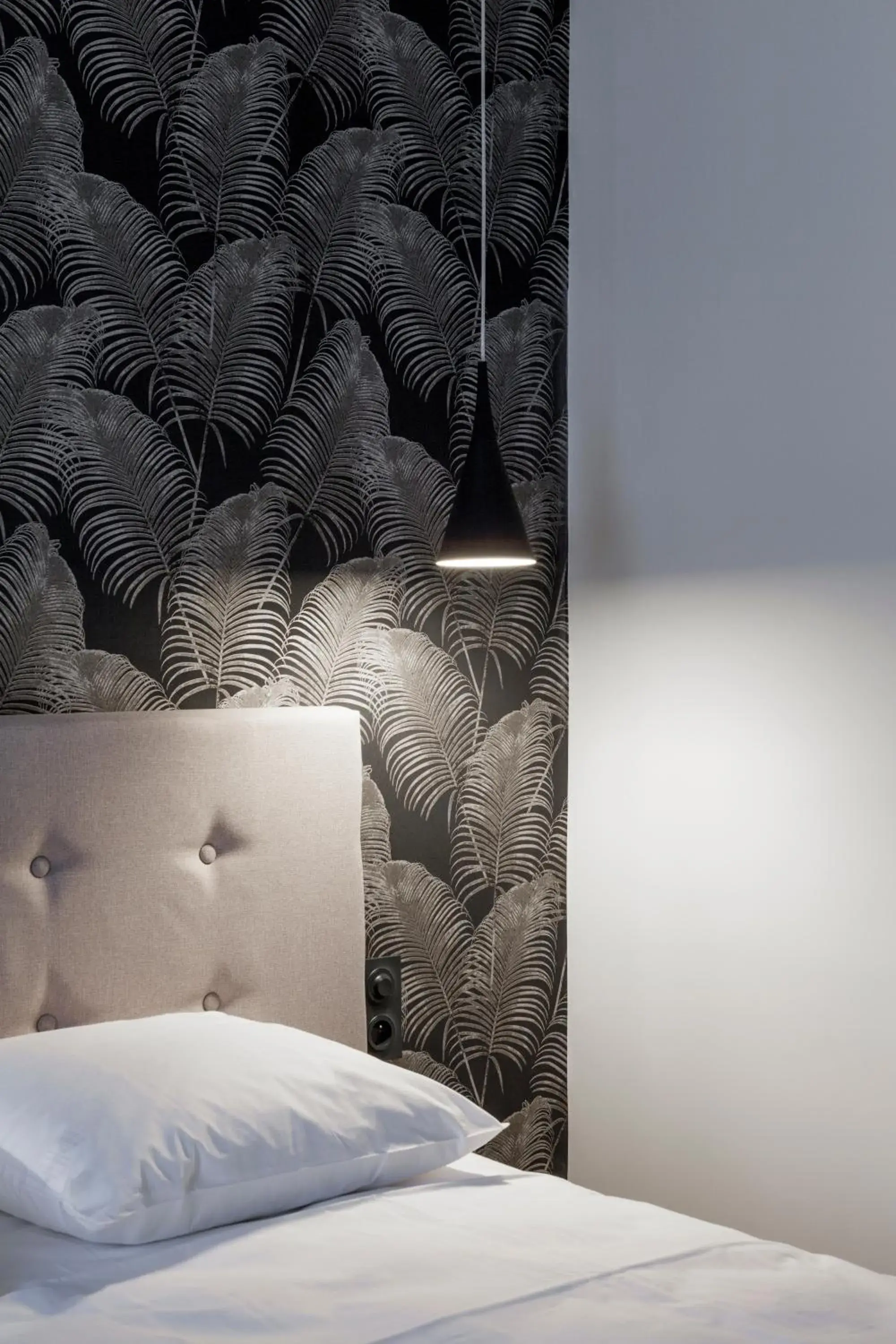 Bed in Logis Hotel du Maine Bed in Logis Hotel du Maine