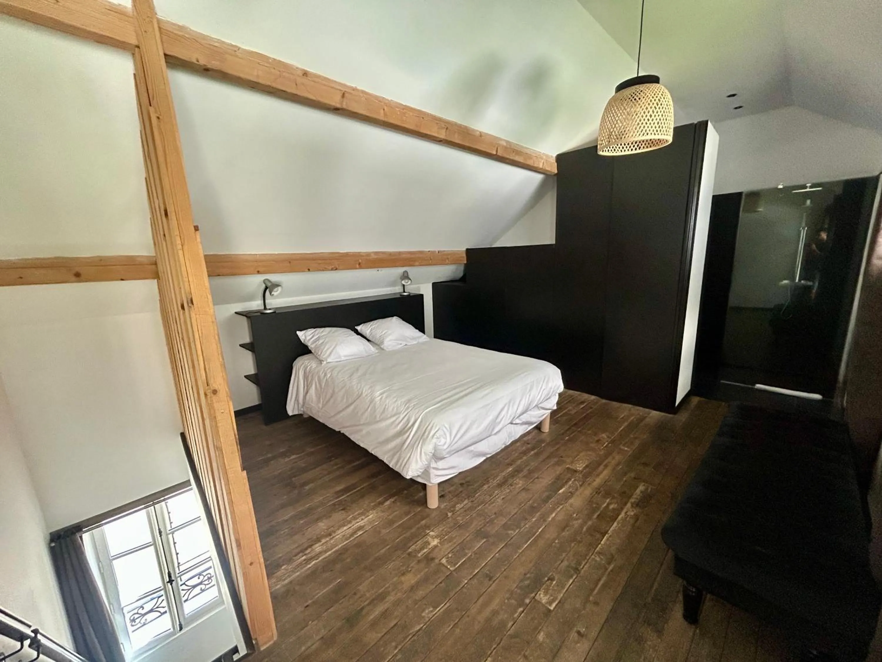 Bed in Logis Hotel du Maine