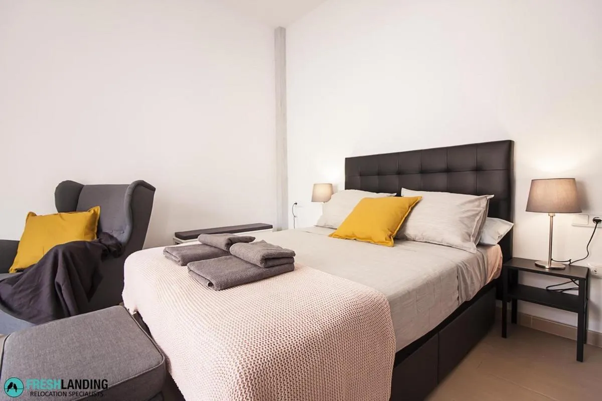 Bedroom, Bed in Rayito by FreshApartments by Bossh! Apartments