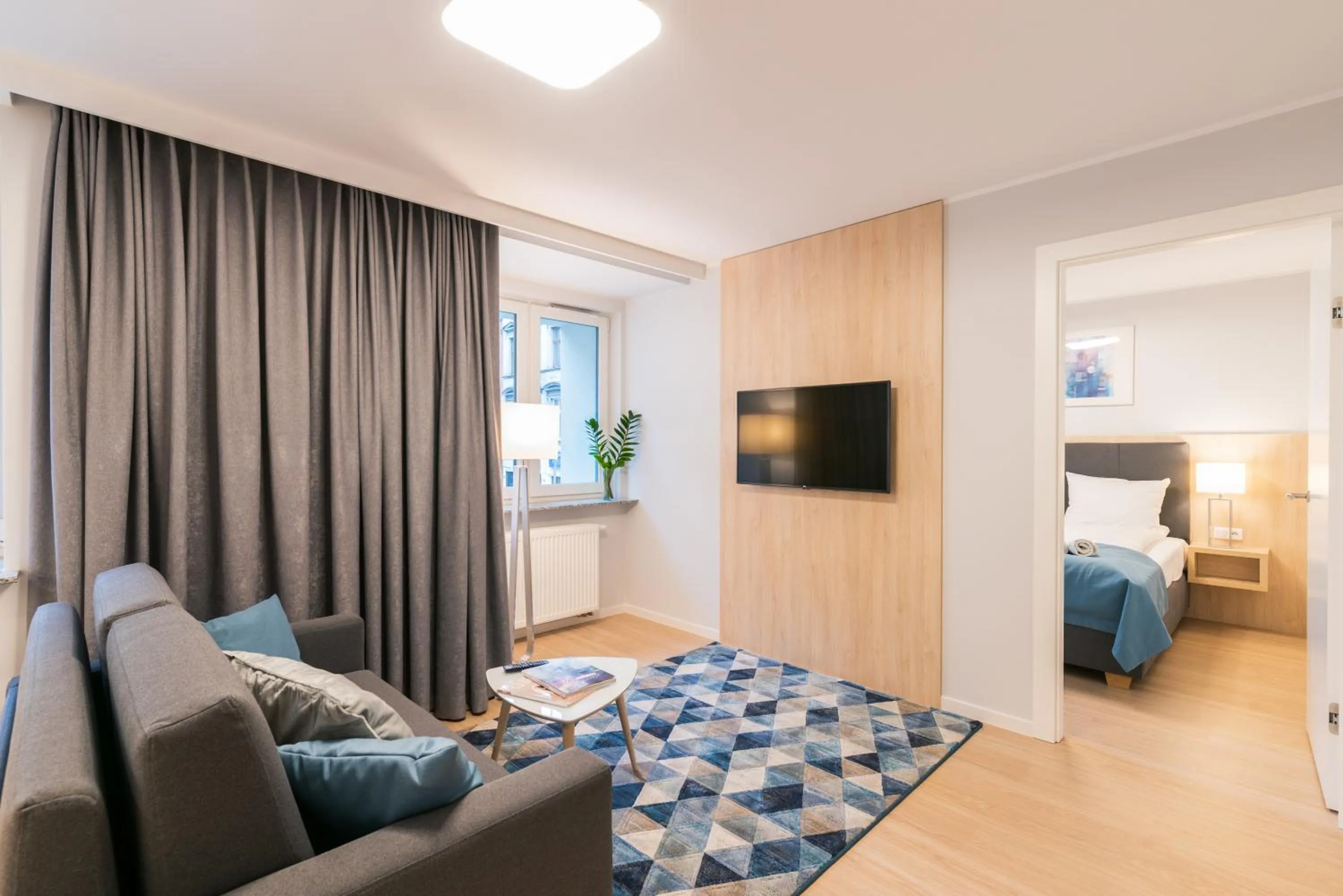 Living room, Bed in Q17 Apartments Rynek