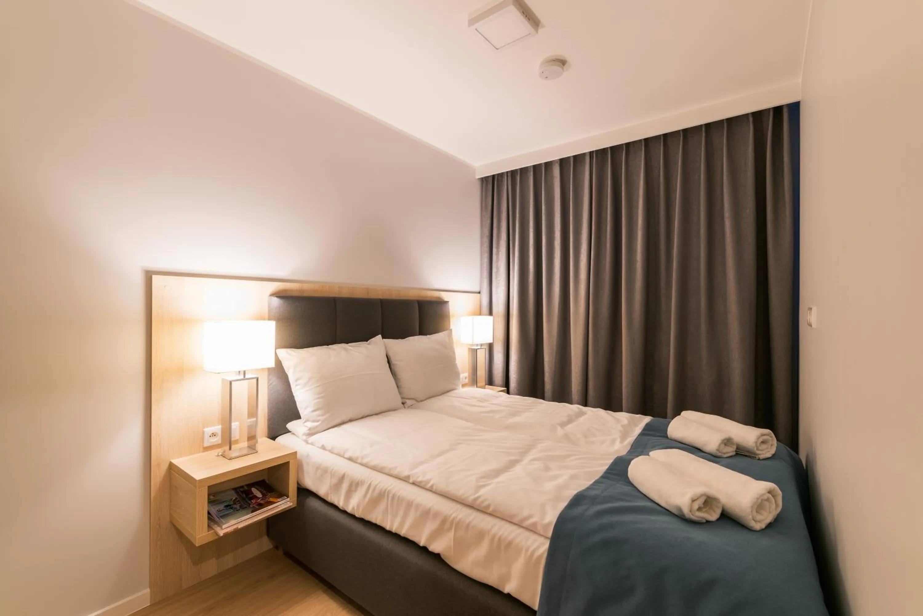 Bed in Q17 Apartments Rynek