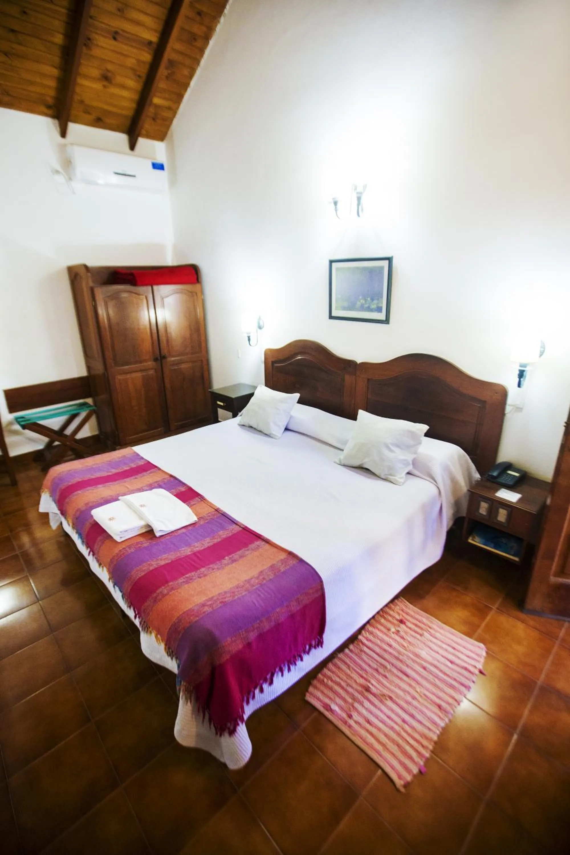 Bed in Hostería Posada del Sol