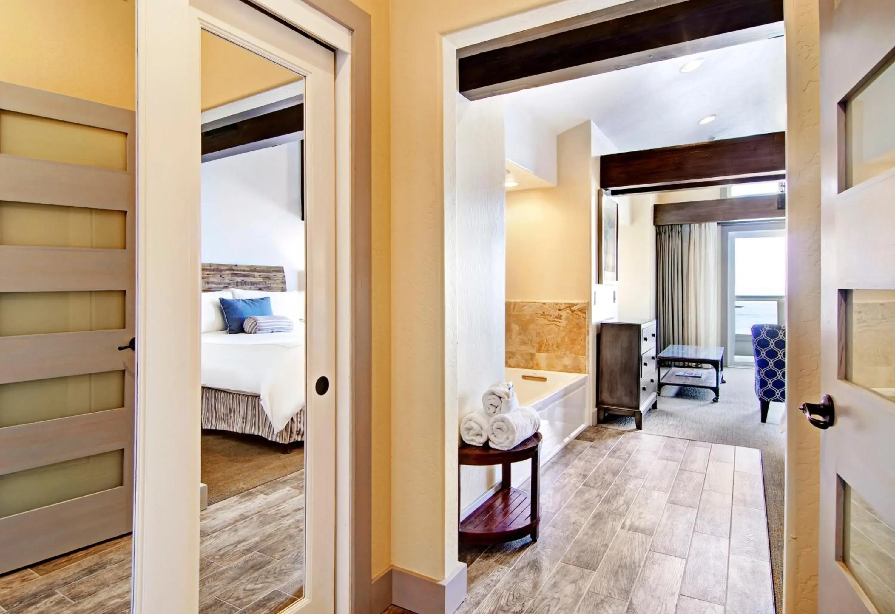 Seating area, Bed in Cypress Inn on Miramar Beach Seating area, Bed in Cypress Inn on Miramar Beach