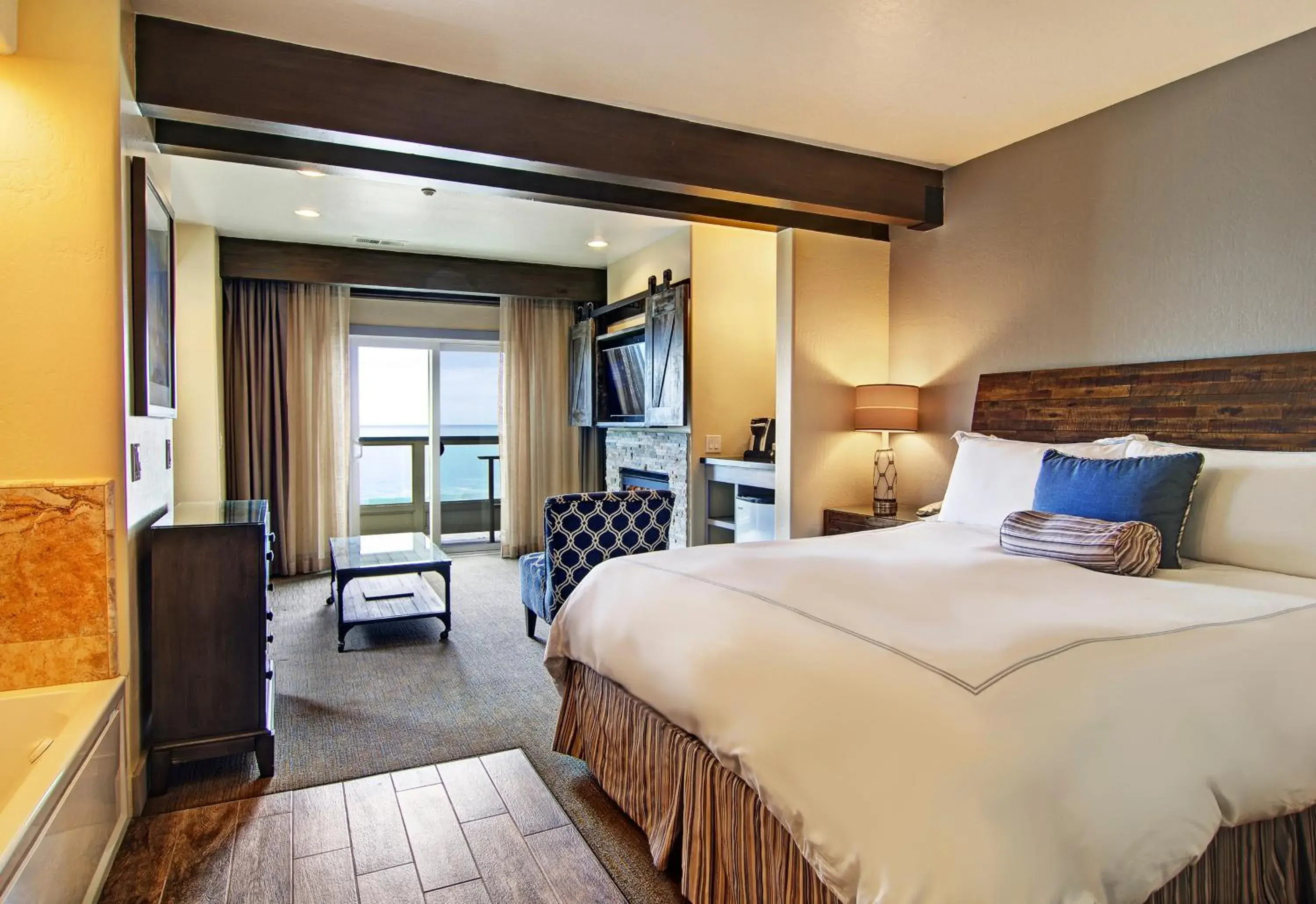 Seating area, Bed in Cypress Inn on Miramar Beach Seating area, Bed in Cypress Inn on Miramar Beach