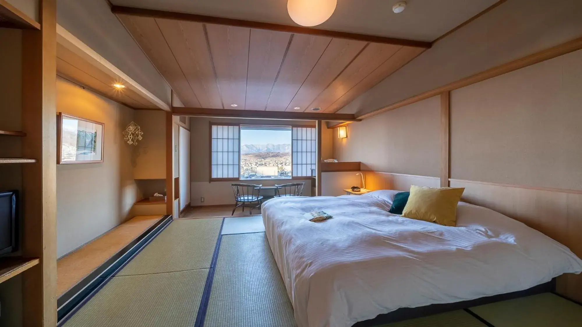 Bed in onsen hotel OMOTO