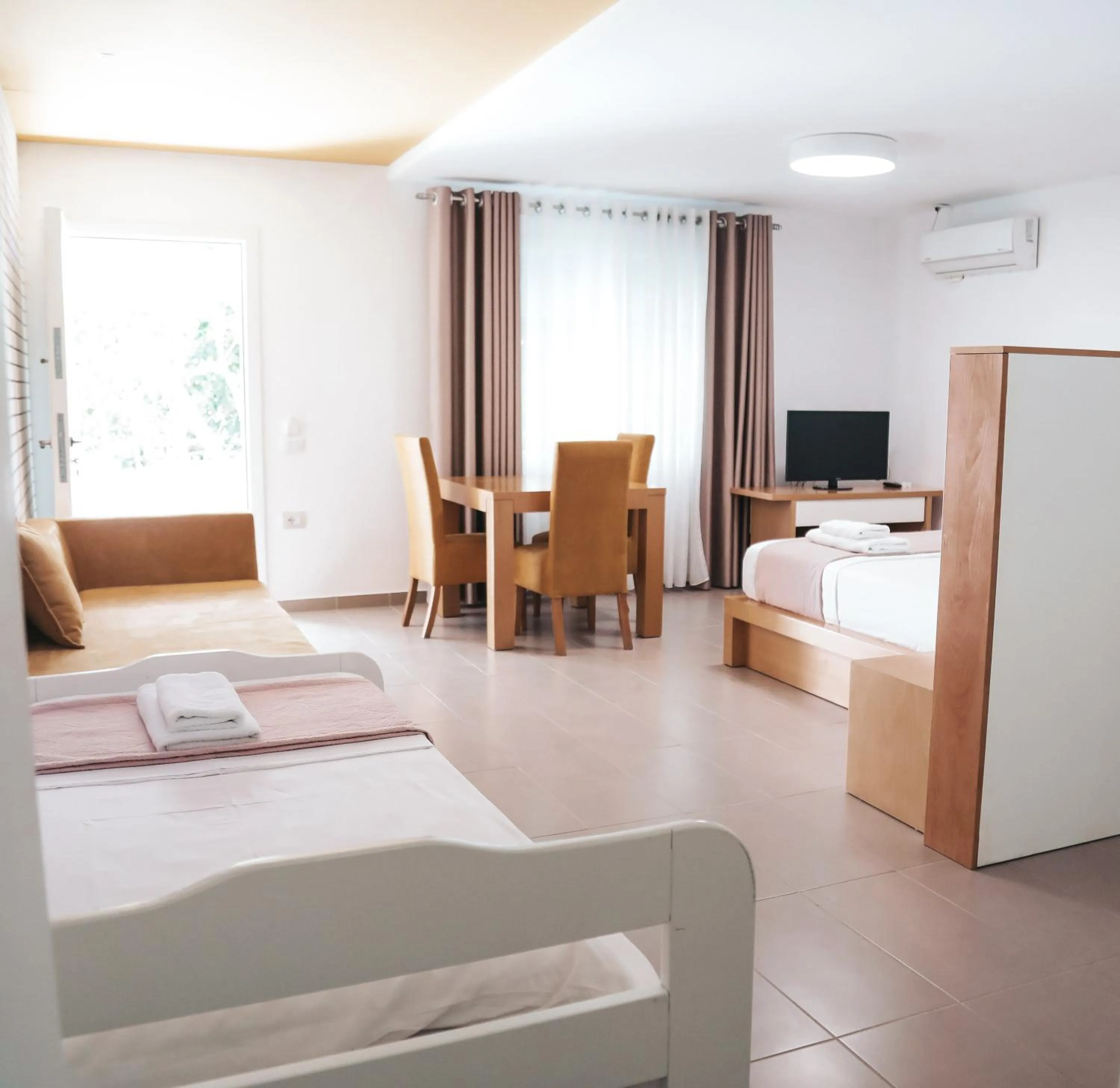 Bed in Sunrise Luxury Apartments