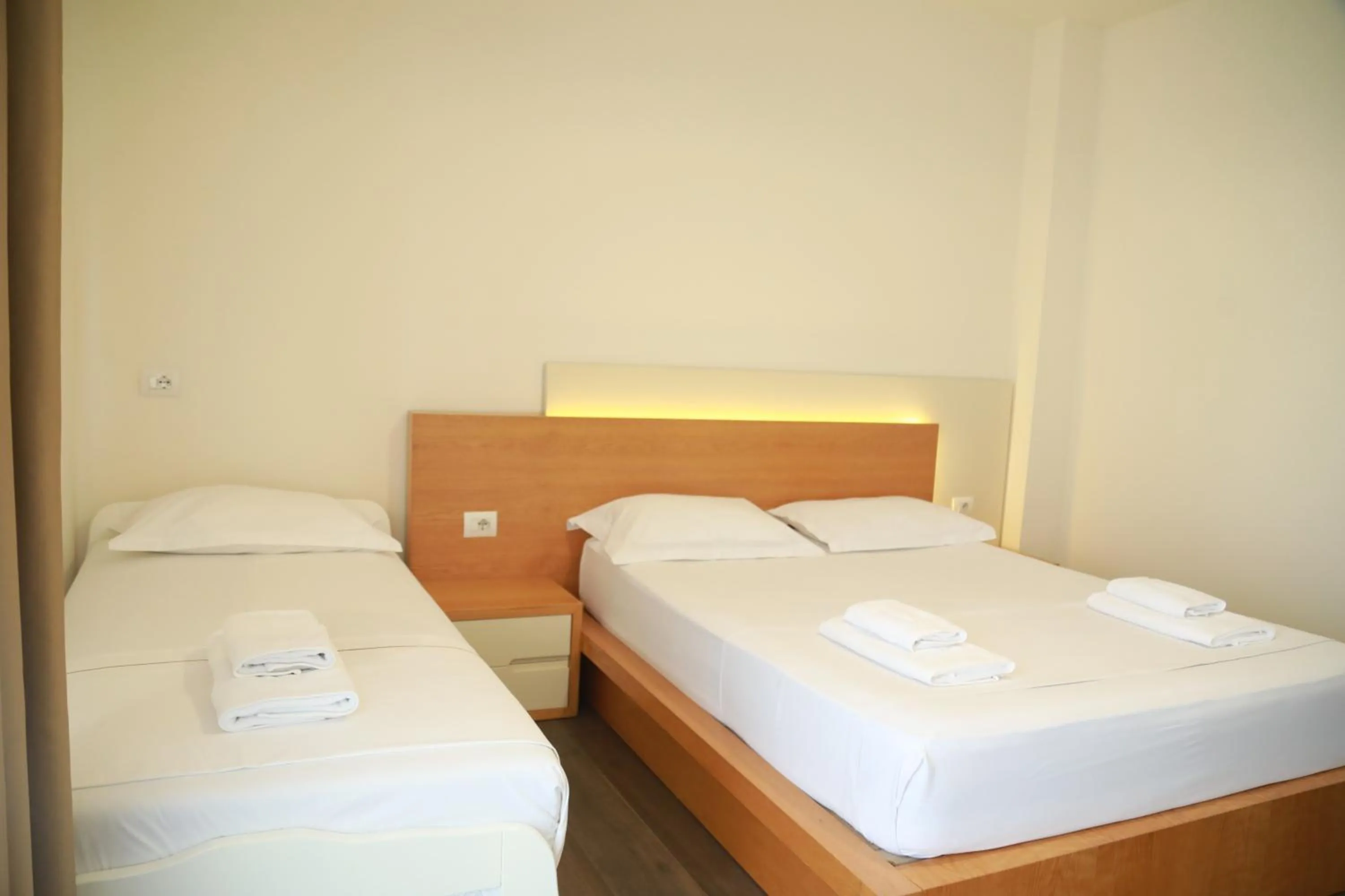 Bed in Sunrise Luxury Apartments