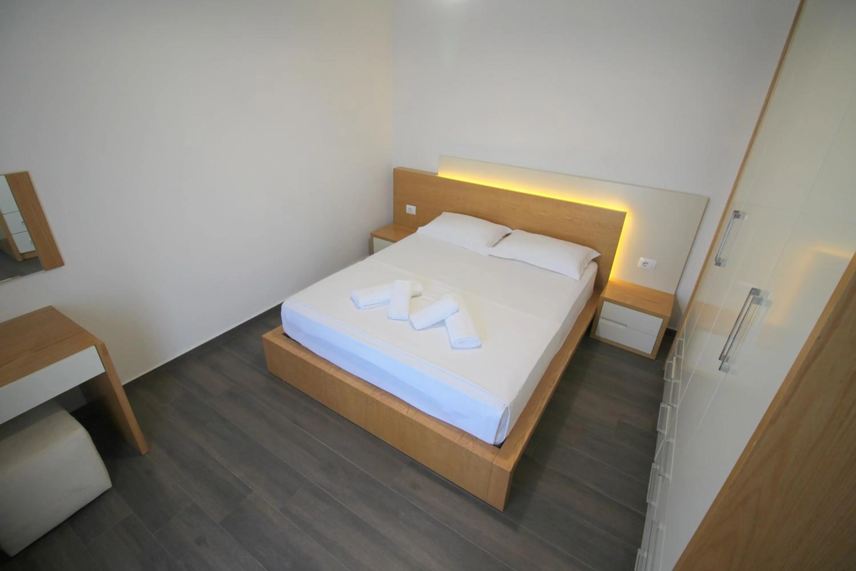 Bed in Sunrise Luxury Apartments