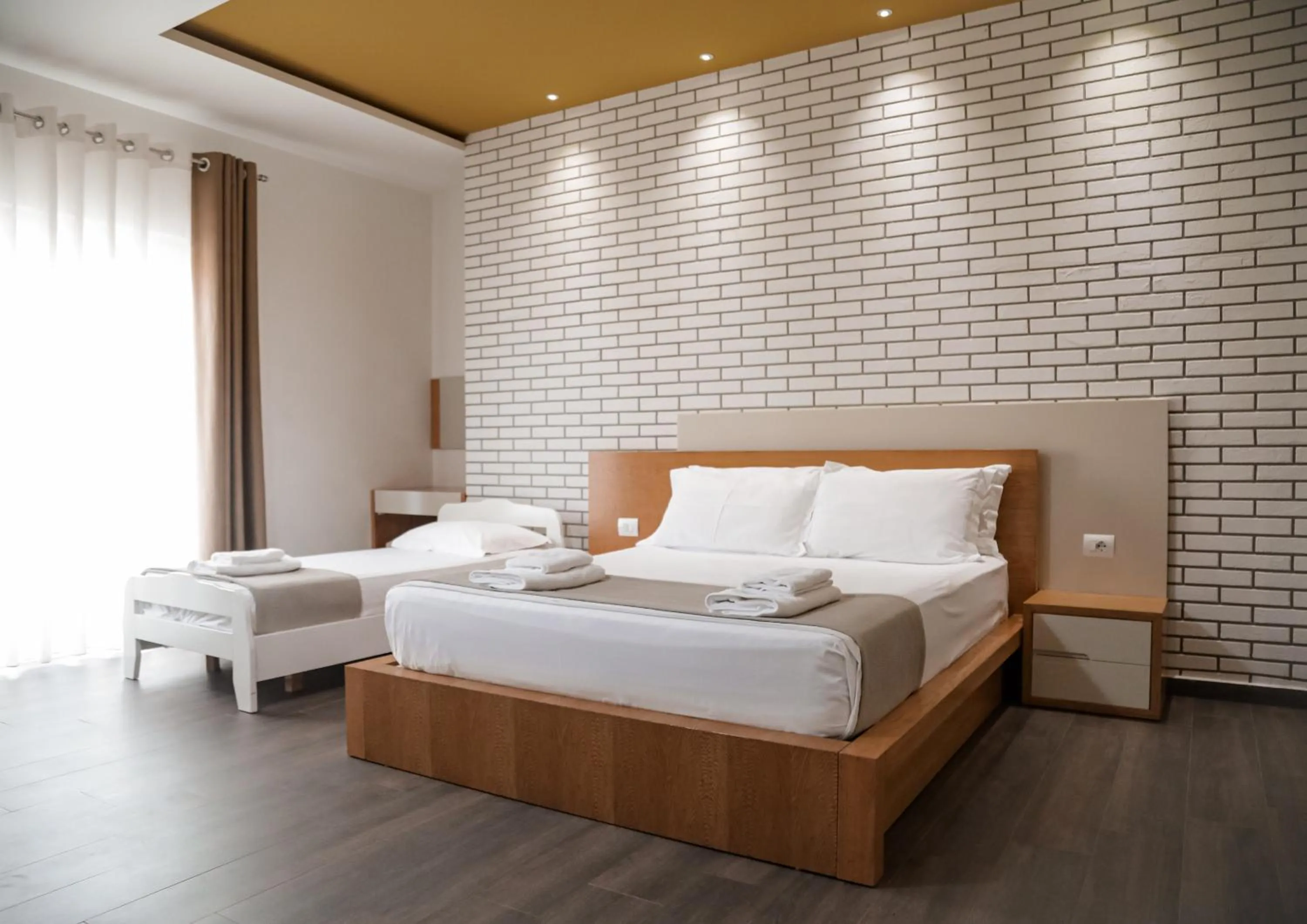 Bed in Sunrise Luxury Apartments