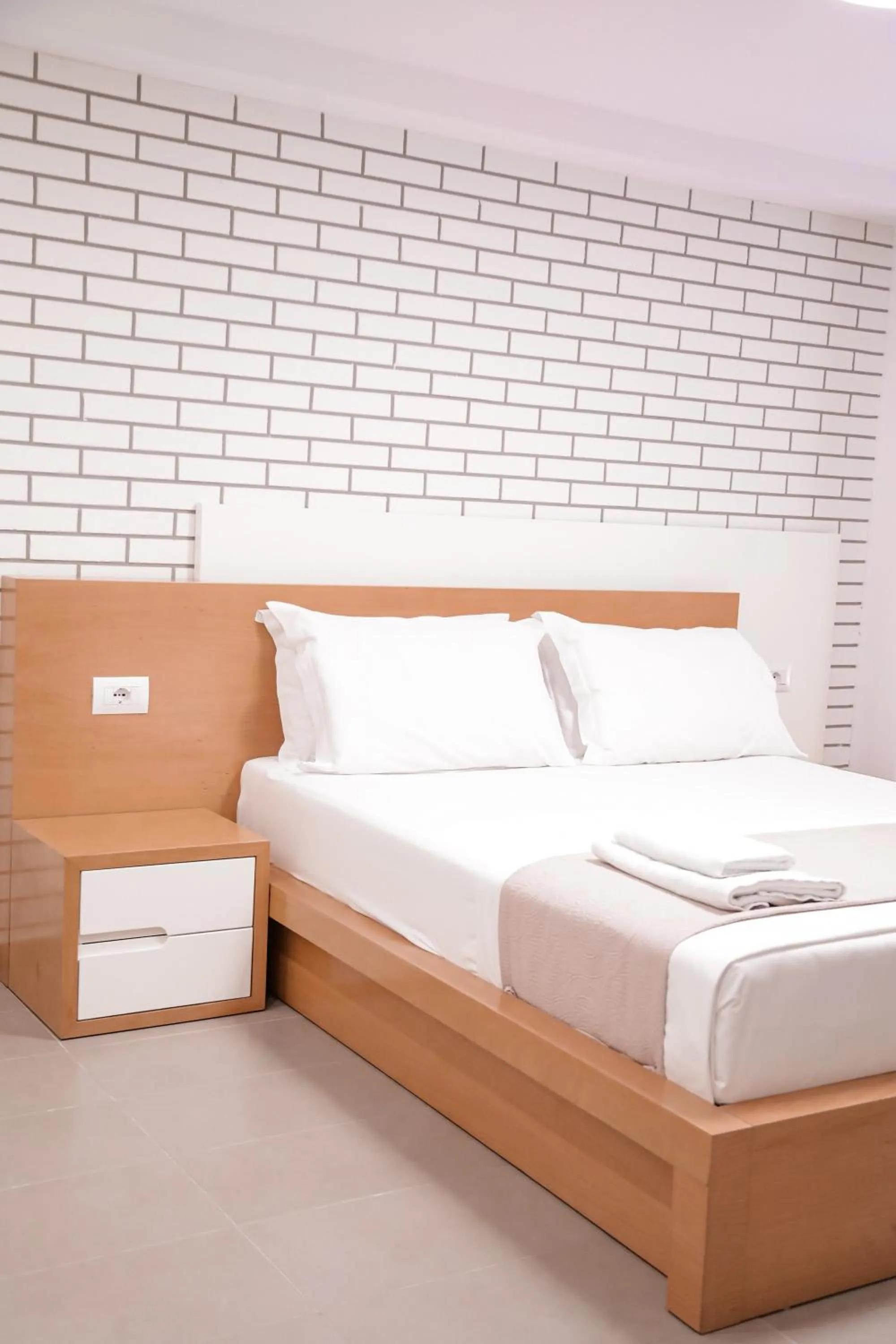 Bed in Sunrise Luxury Apartments