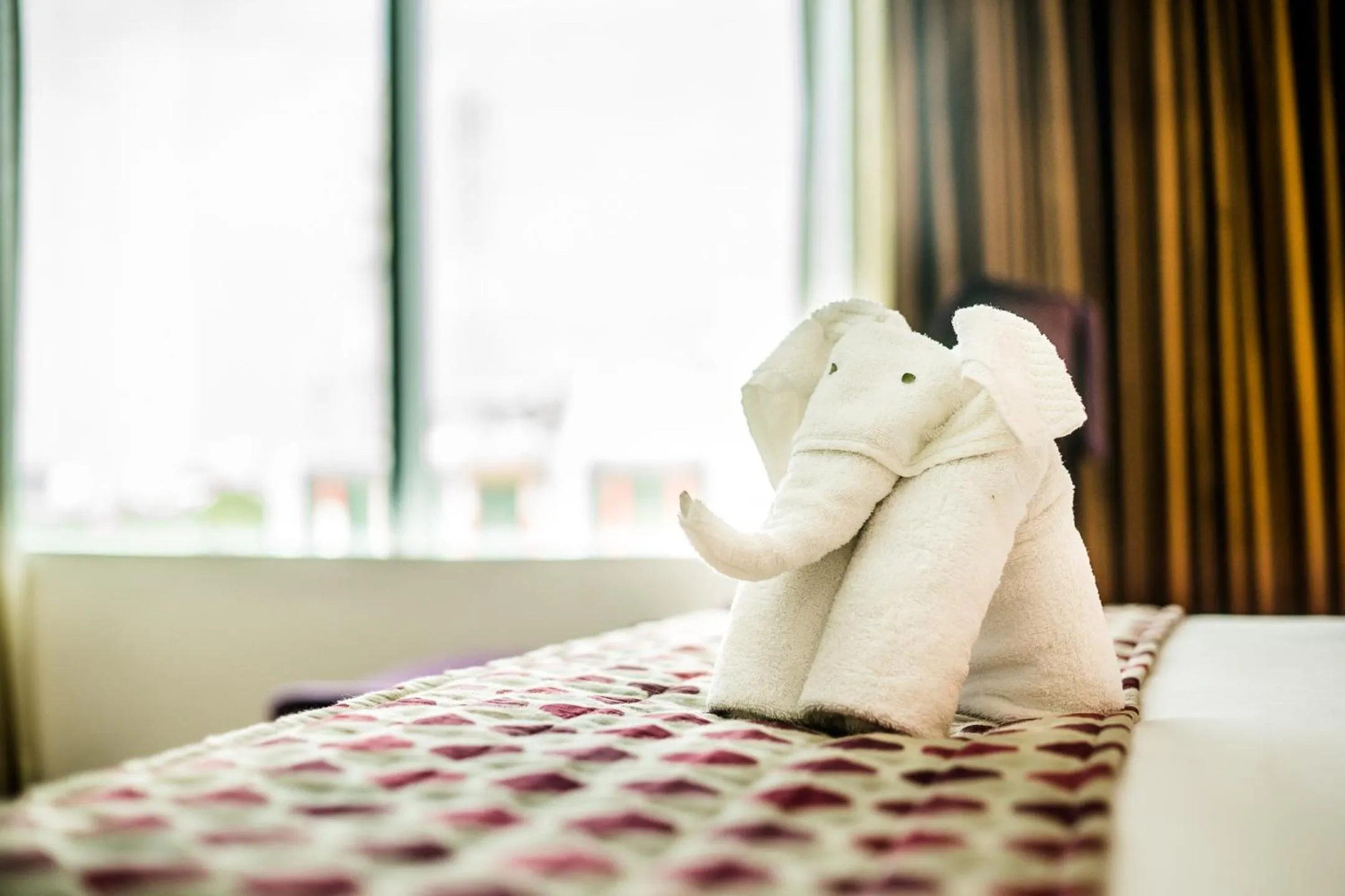 Bed in Clarion Hotel President Chennai