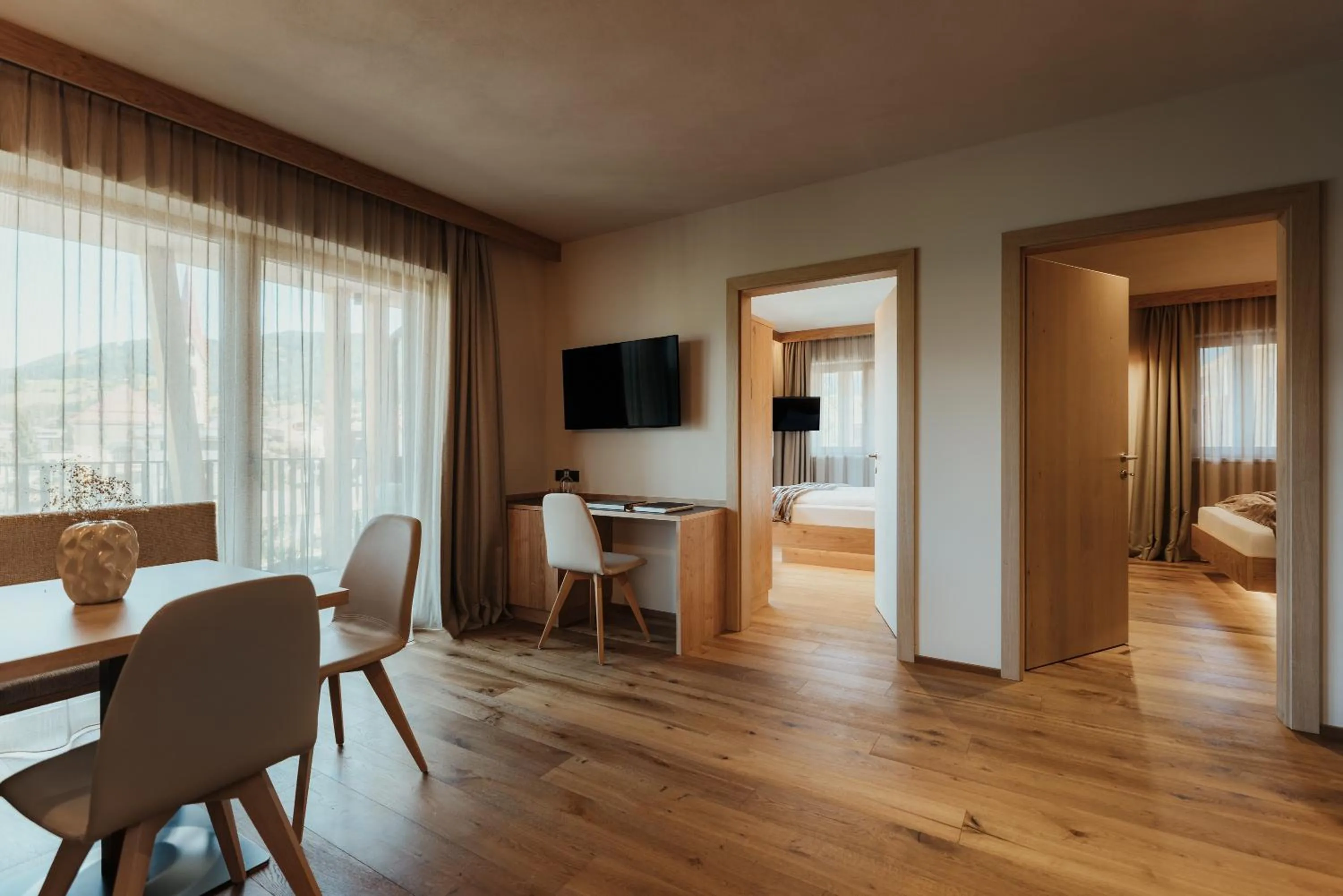 Communal lounge/ TV room, Bed in Hotel B&B Feldmessner