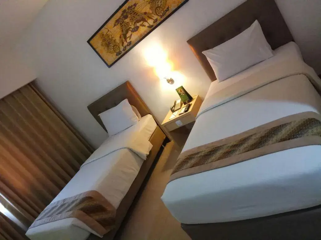 Bed in Hotel Arjuna Yogyakarta