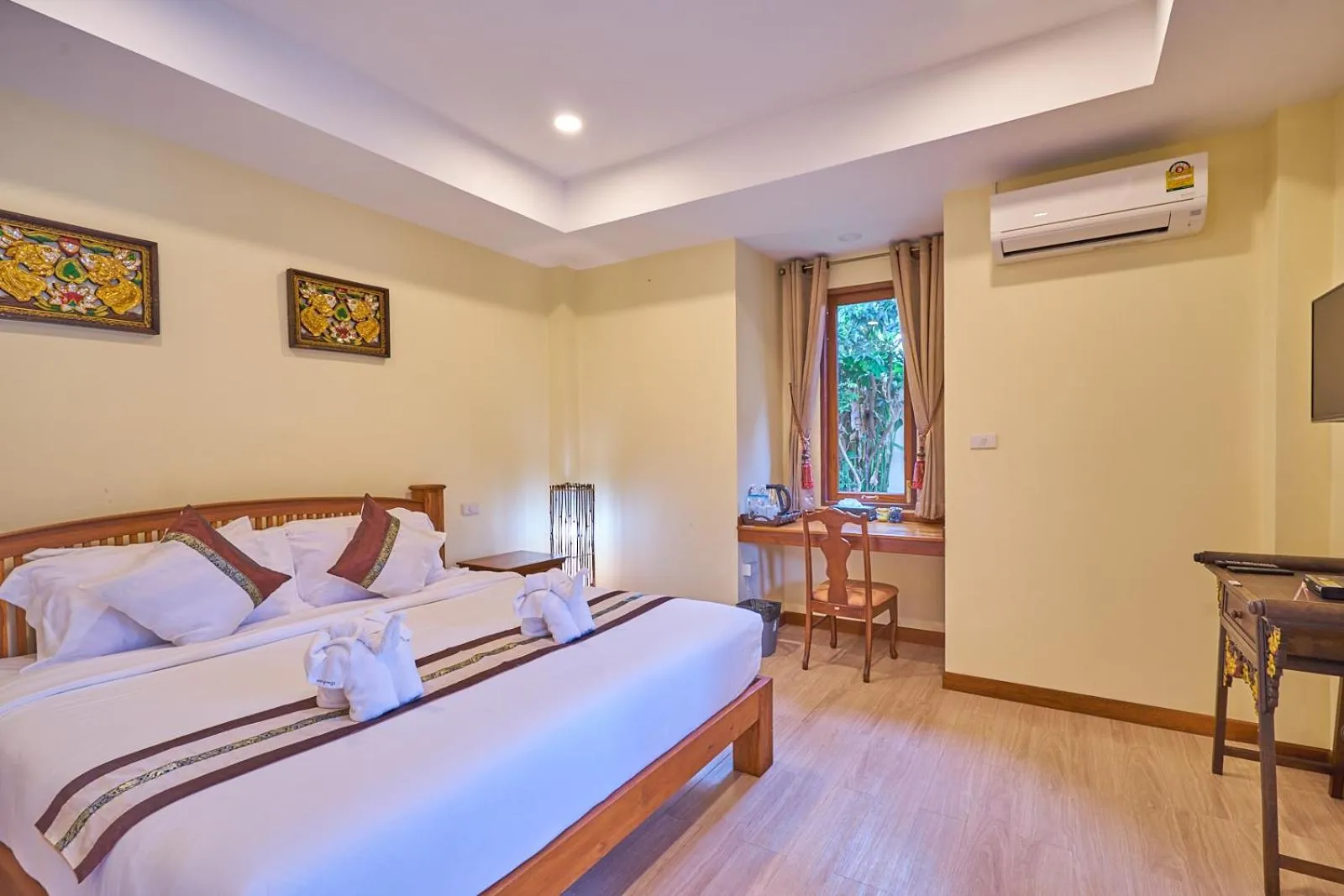 Bed in Mina Garden Villa Resort