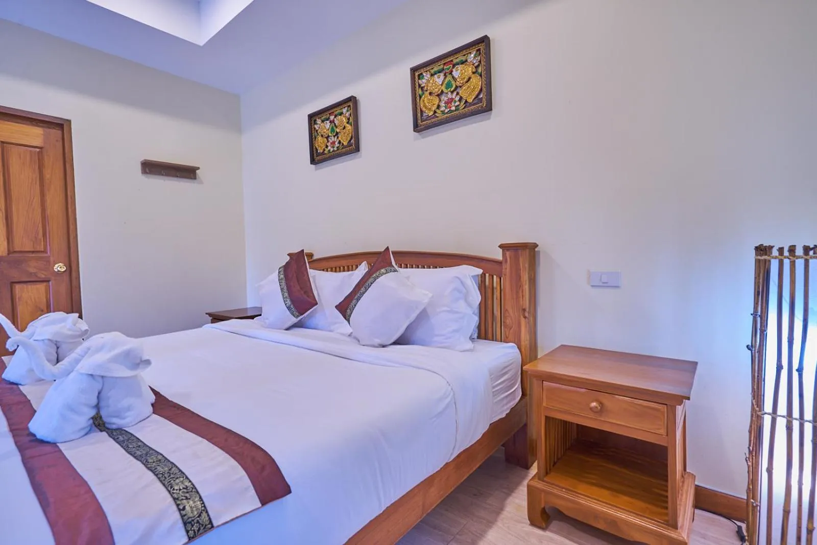 Bed in Mina Garden Villa Resort