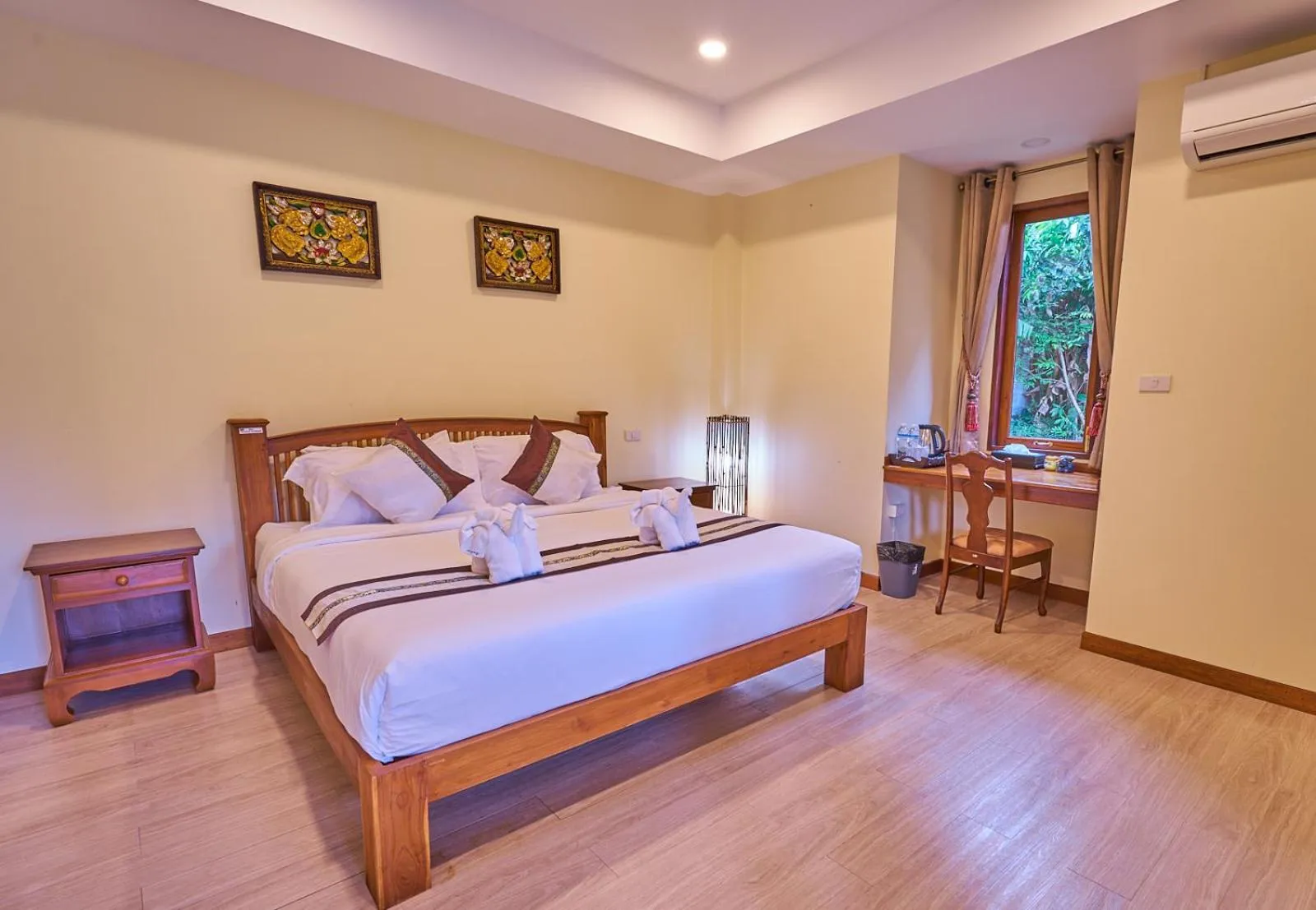 Bed in Mina Garden Villa Resort