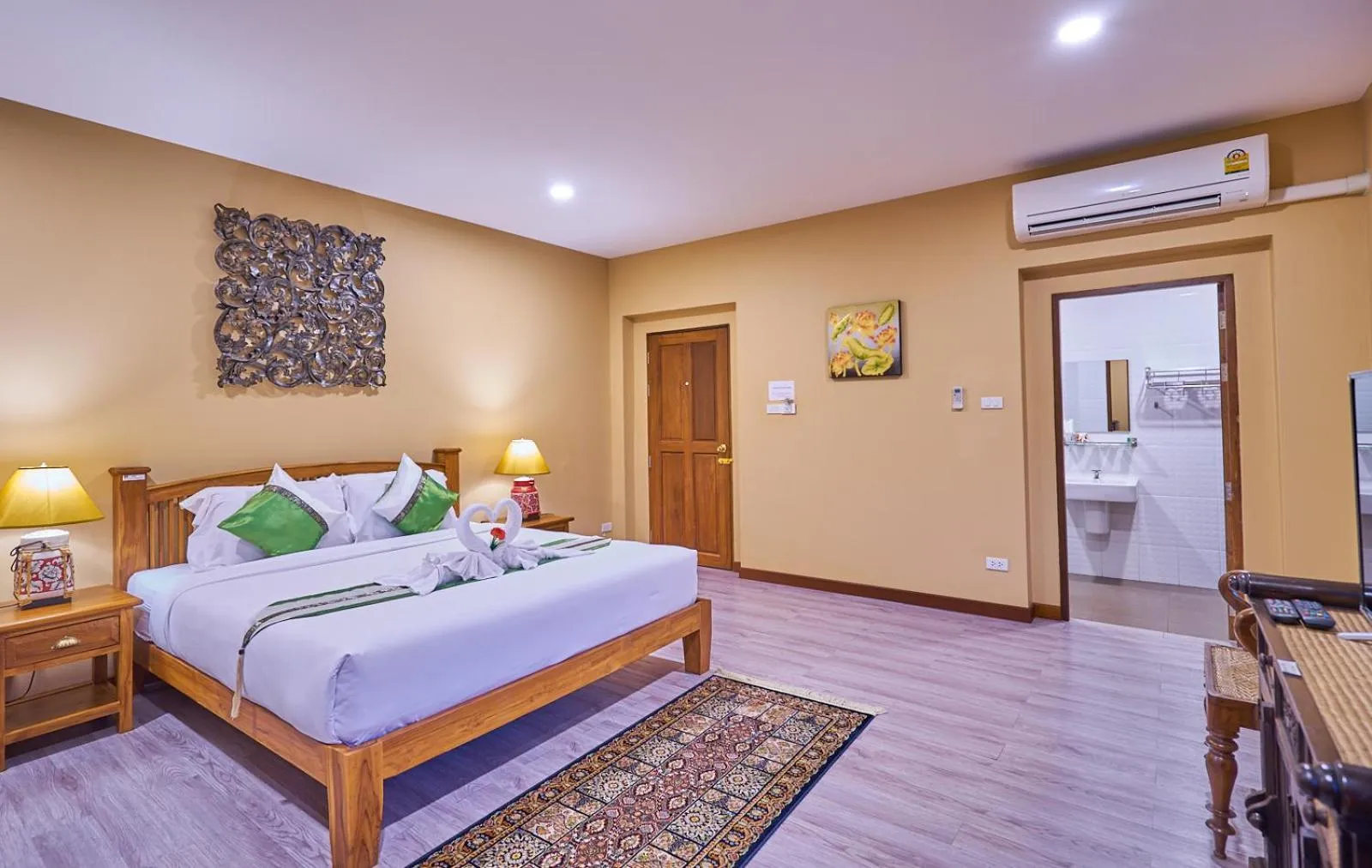 Bed in Mina Garden Villa Resort