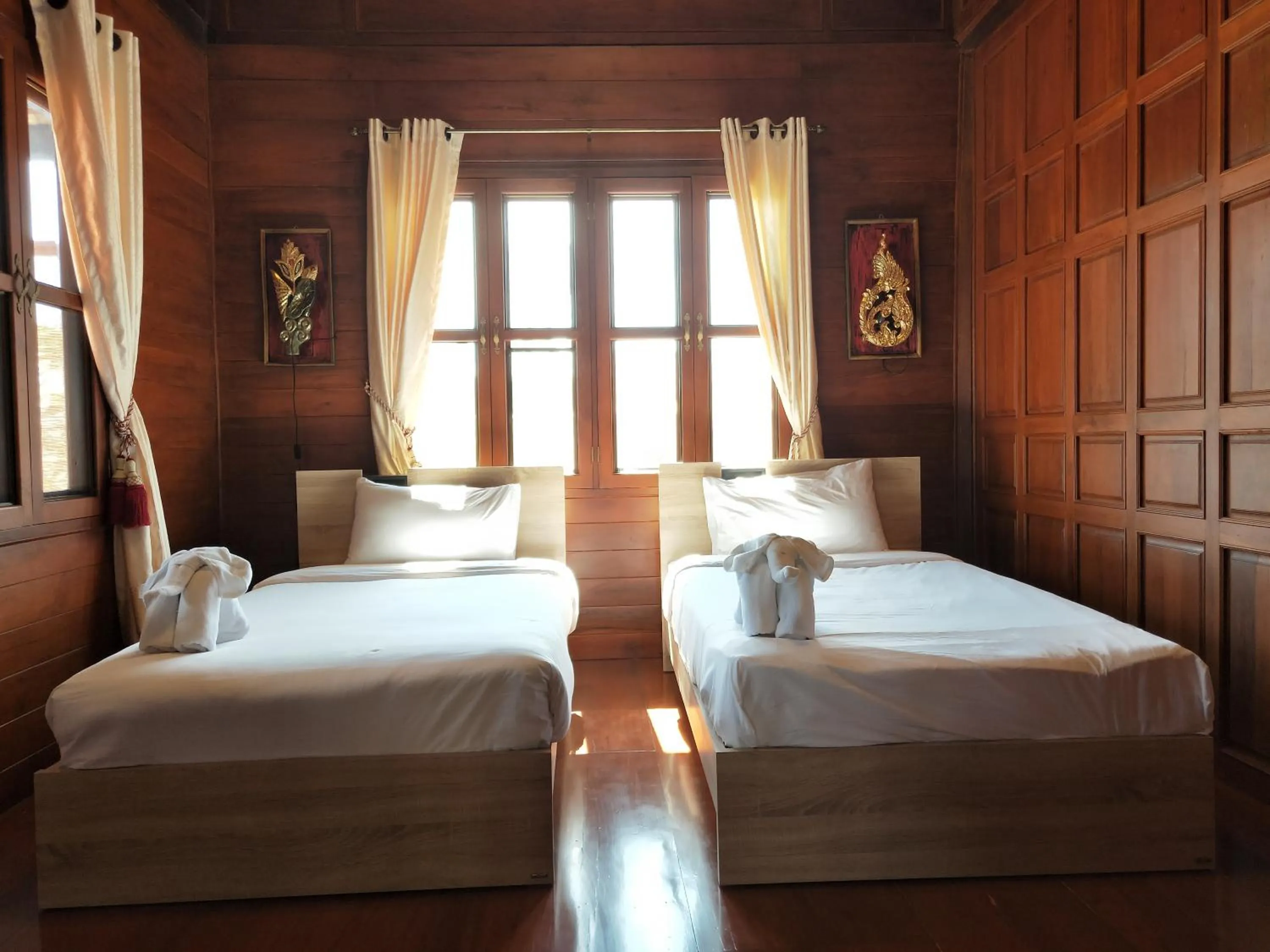 Bed in Mina Garden Villa Resort