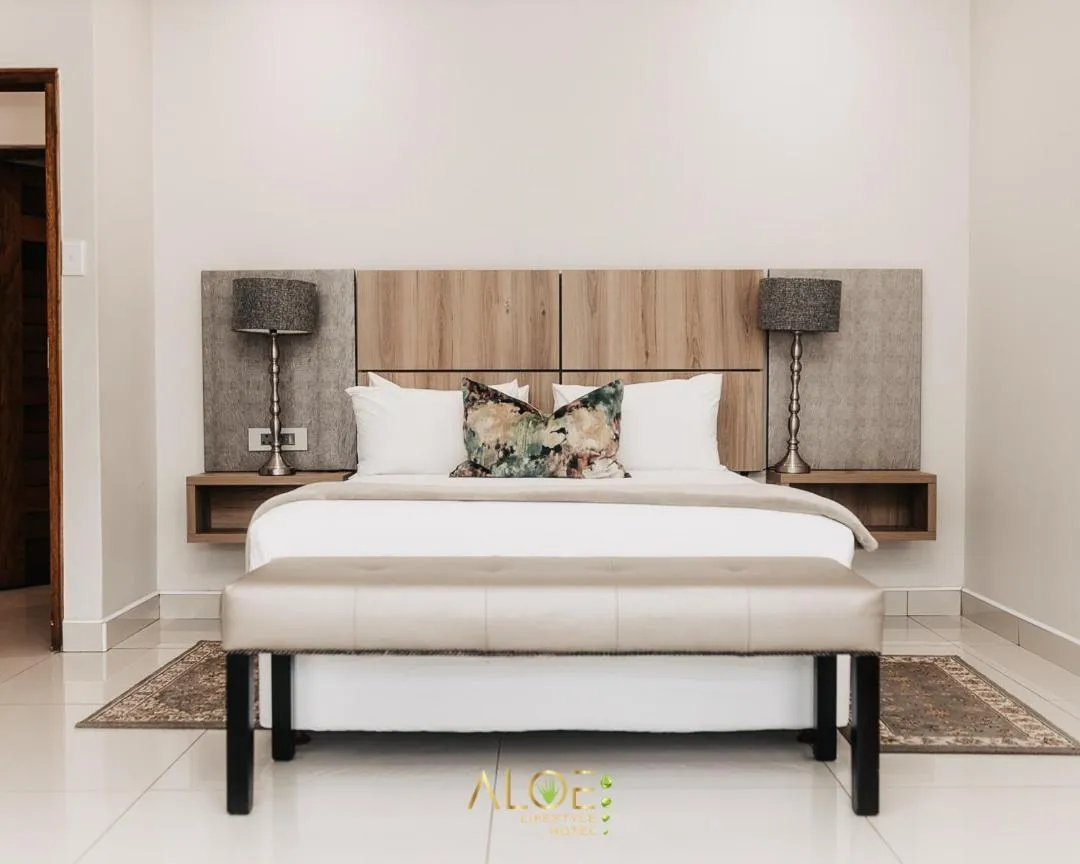 Bed in Aloe Lifestyle Hotel