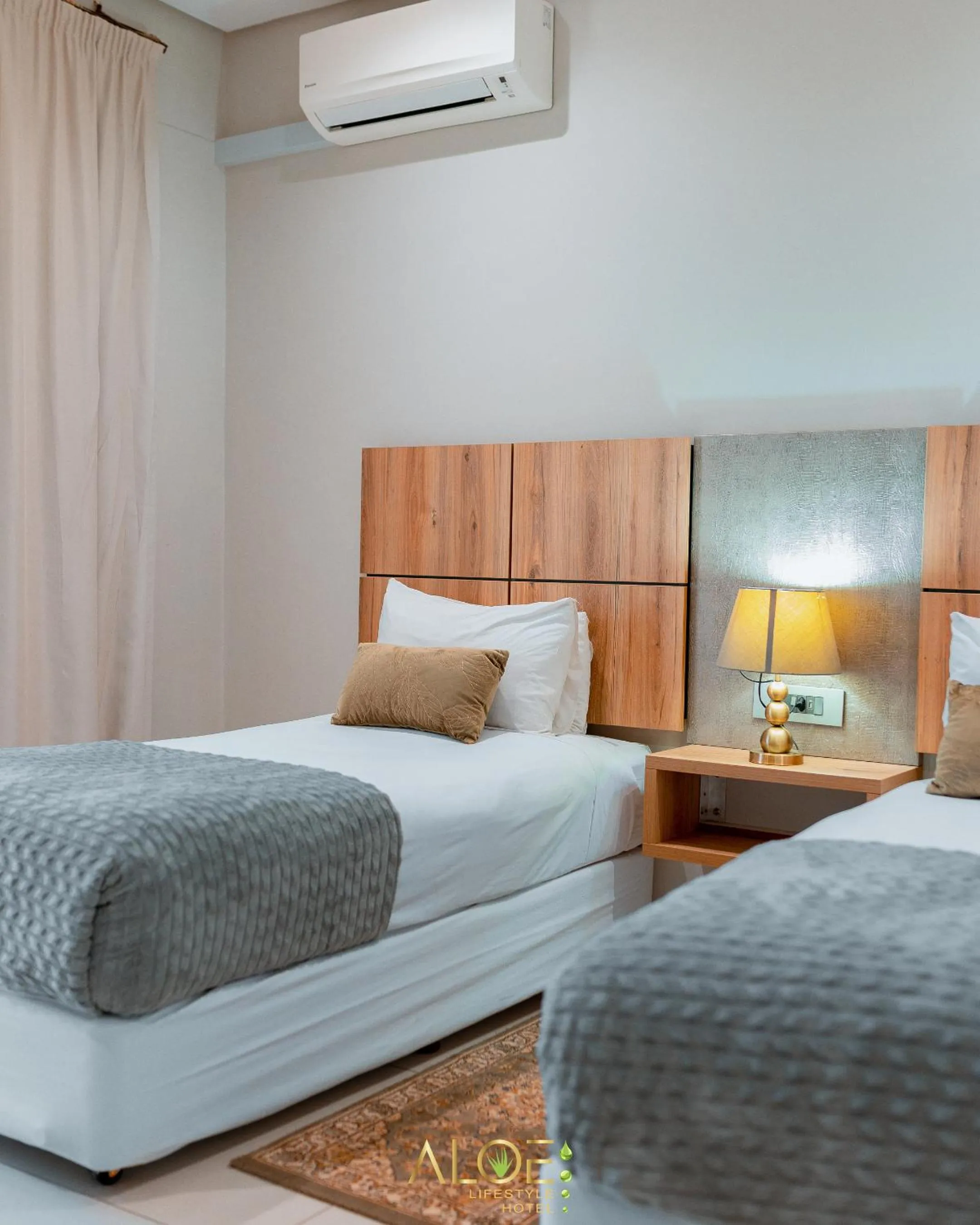 Bed in Aloe Lifestyle Hotel